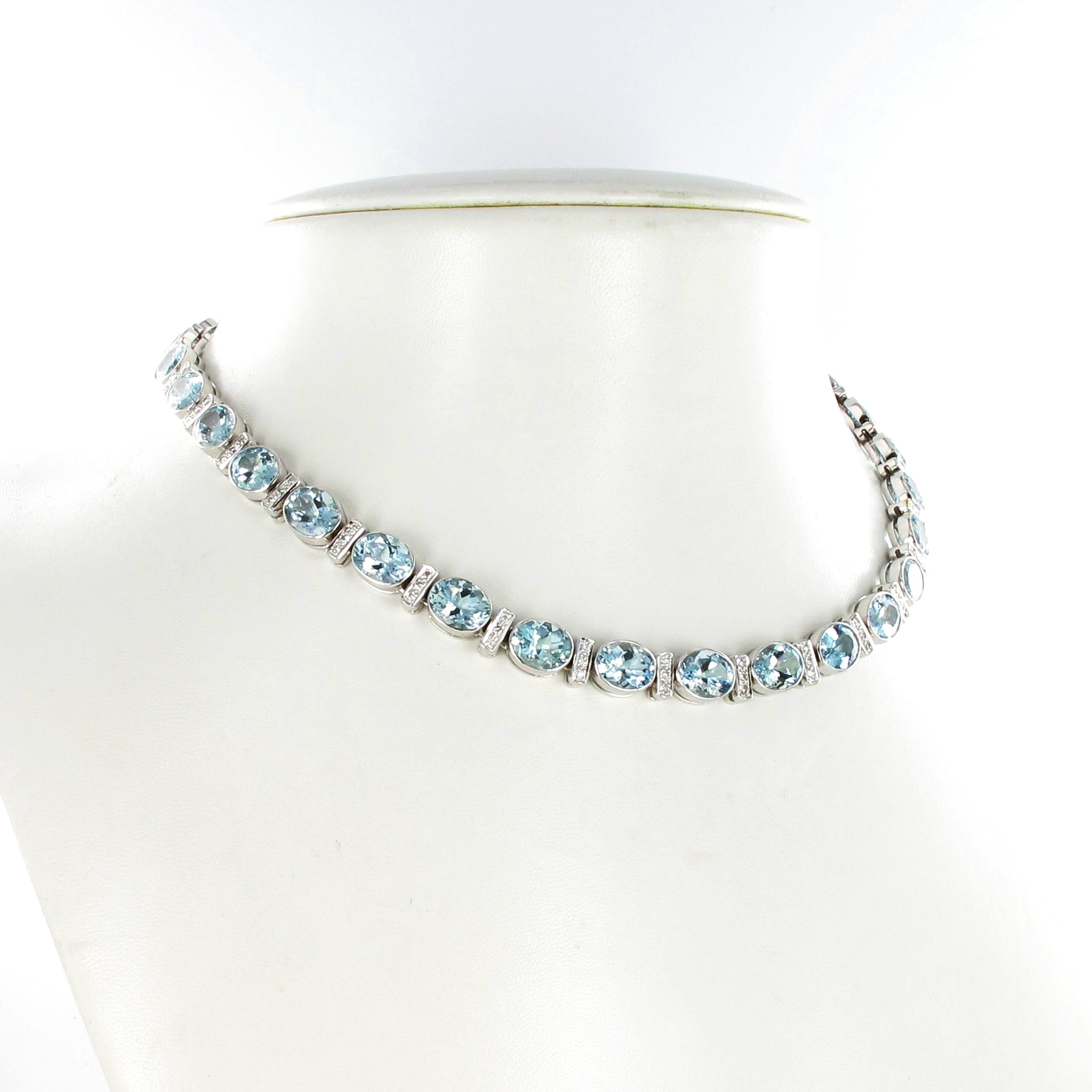 This classic and timeless necklace in 18 karat white gold is bezel set with 31 oval cut aquamarines of soft blue colour and with a total weight of approximately 49.60 carats. The aquamarines are separated by fine bars, each set with 3 brilliant cut