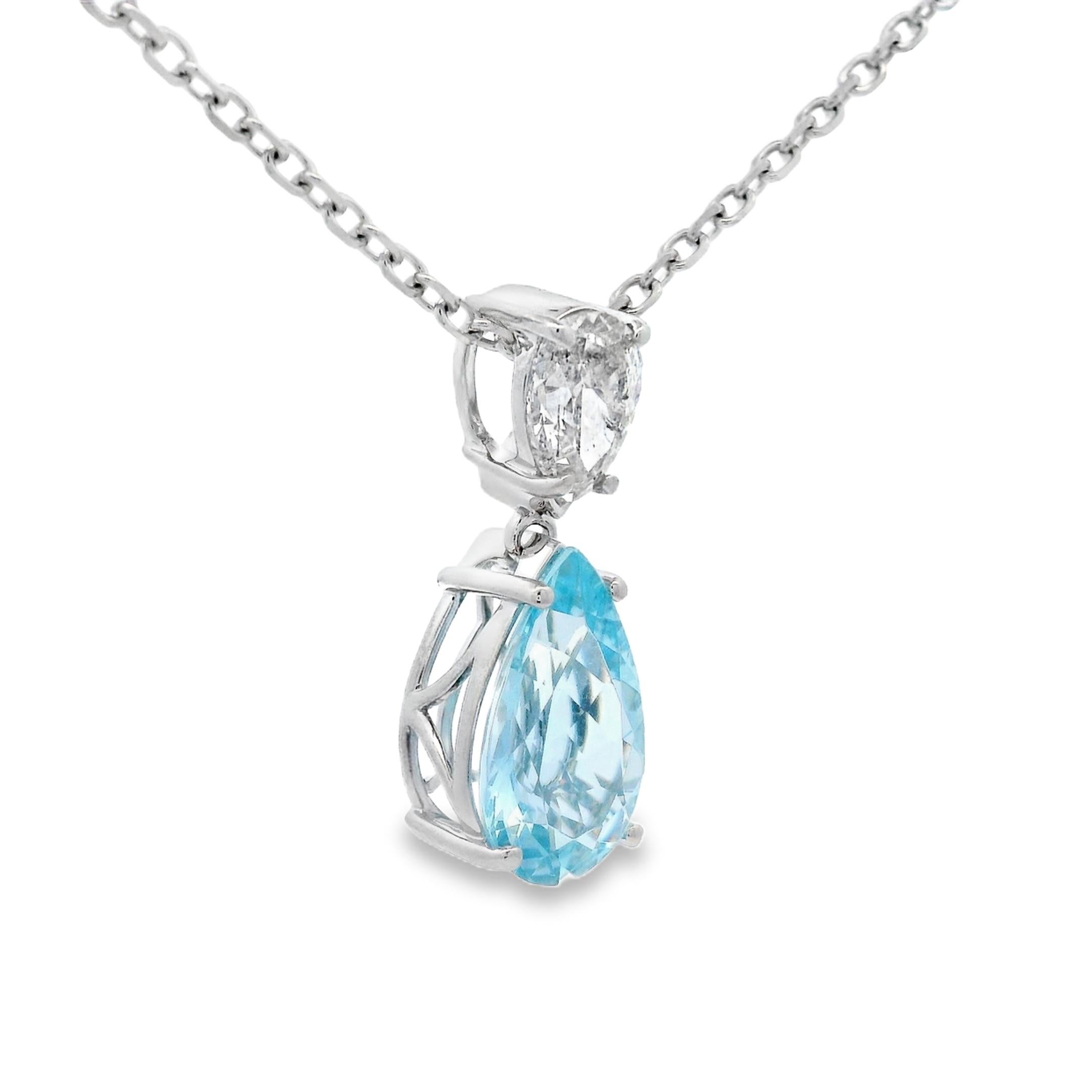 This refined drop pendant features a 2.95-carat pear-shaped AAA quality Aquamarine, measuring 14mm x 8mm, suspended beneath a 1-carat pear-shaped Natural Diamond. The pairing highlights contrast in brilliance and hue - the cool, oceanic blue of the