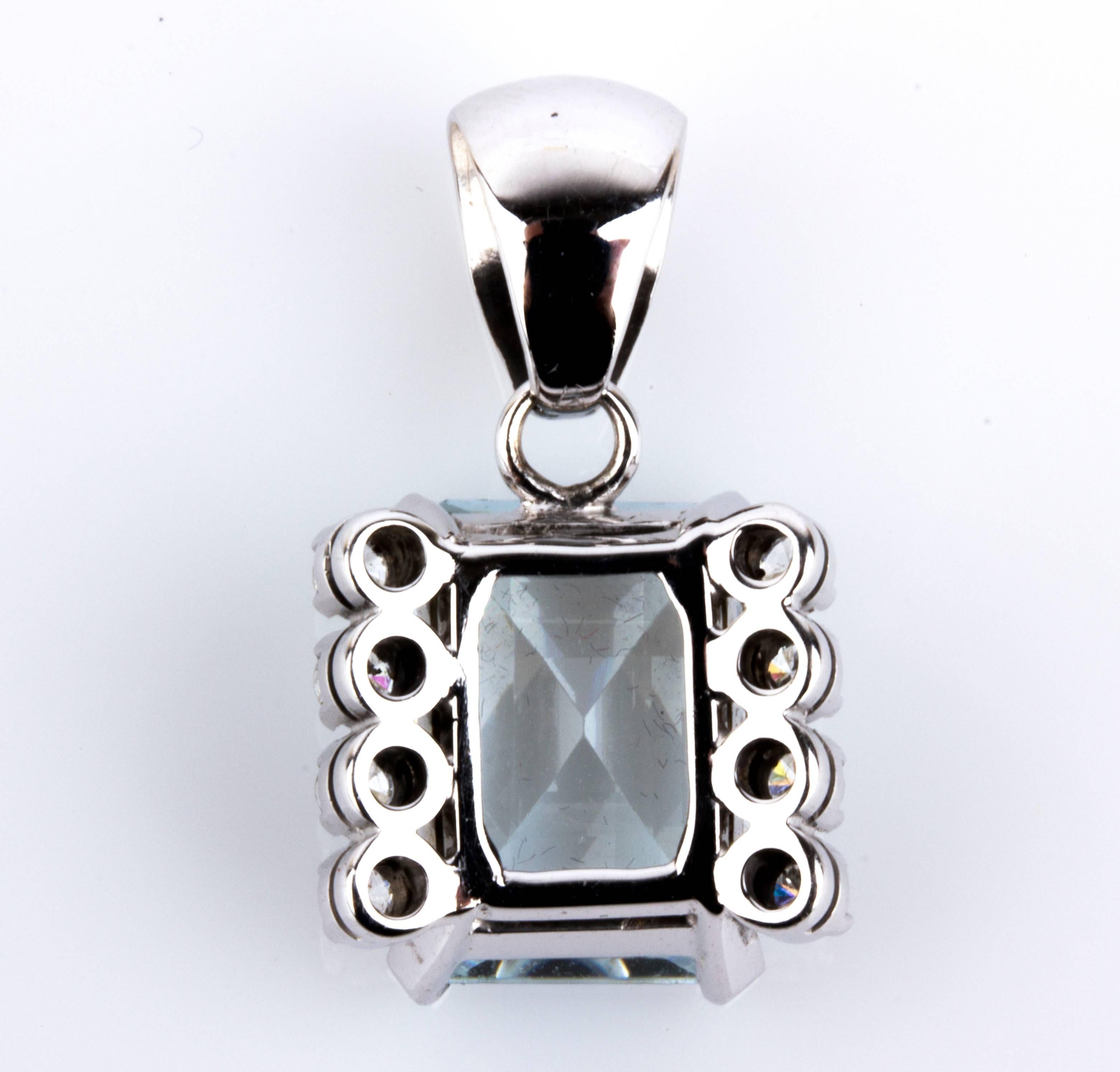 Embellished with step-cut aquamarine flanked by two rows of three diamonds. Weight 5.75 gr. 