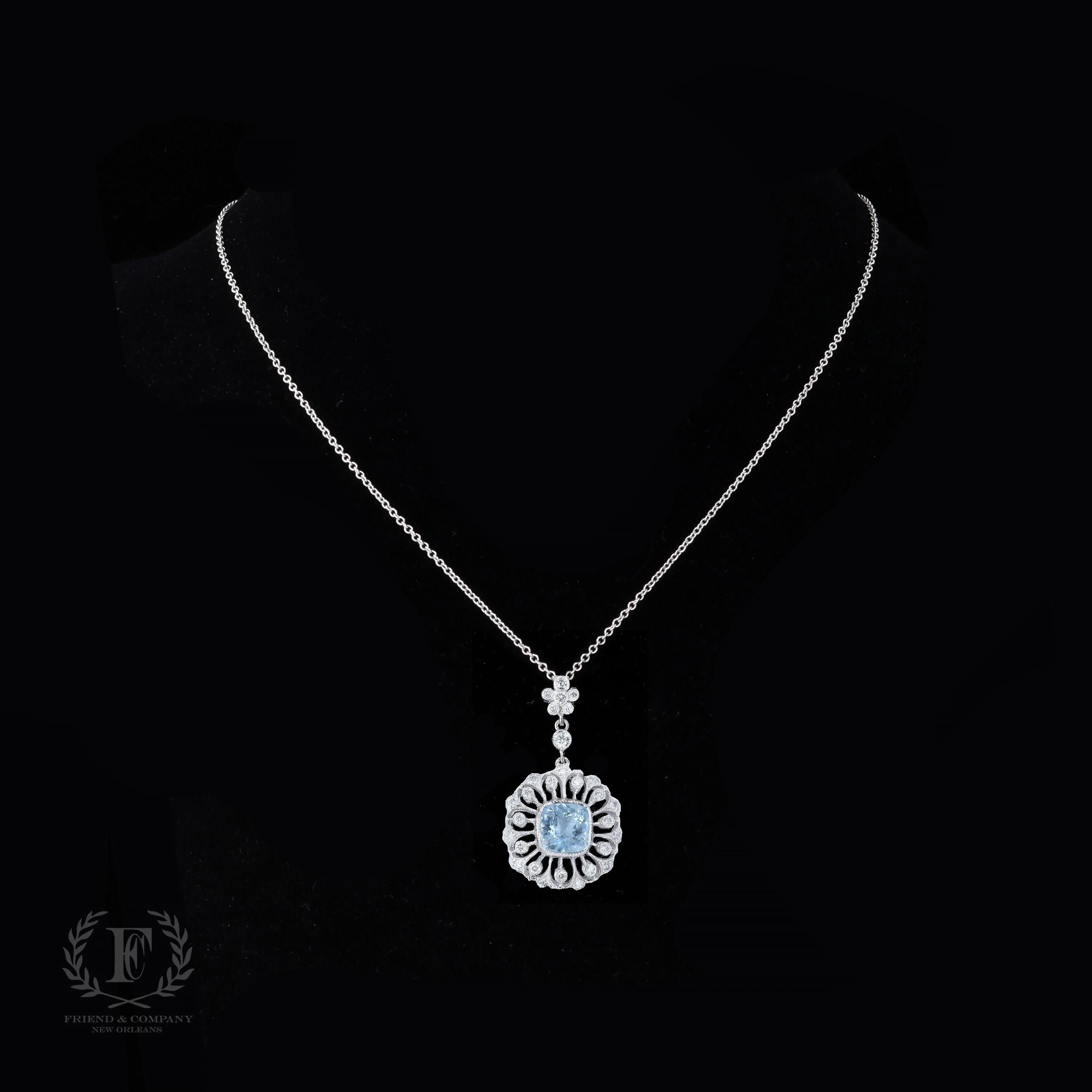 This necklace is an aquamarine dream. The necklace features a gorgeous pendant that is set with cushion cut aquamarines weighing approximately 2.50 carats. The aquamarine is accentuated by round cut diamonds. The pendant measures 31 millimeters by