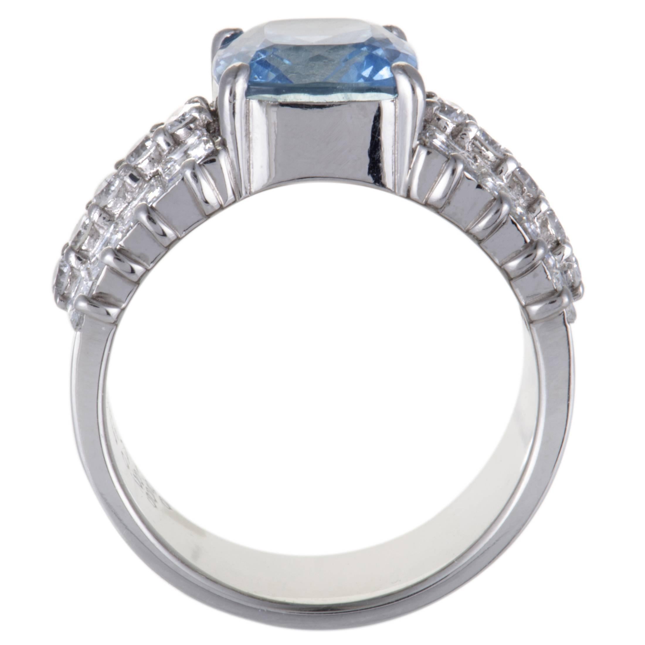 This gorgeous ring features an enthralling design and compels with its distinctly feminine appeal. The ring is made in the prestigious gleam of platinum and is set with resplendent diamond stones that weigh 1.91 carats and a captivating aquamarine
