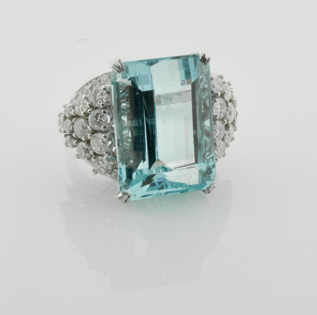 Aquamarine and Diamond Platinum Ring 20.00 carats 
One Emerald Cut Cut Aquamarine weighing 20.00 carats [19.3 x 14.00 x 10.05] approximately [bright with no imperfections visible to the naked eye]
Forty Five Round Brilliant Cut Diamonds weighing
