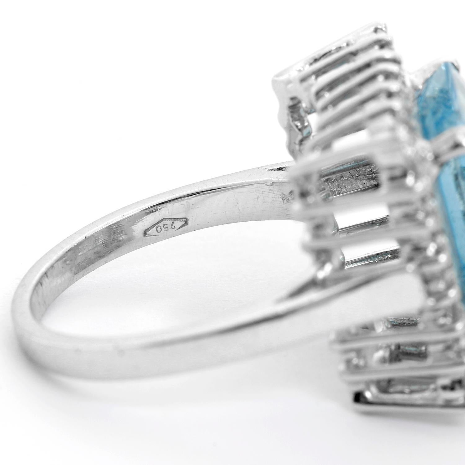 Aquamarine and Diamond Ring Size 7.5  - Step-cut aquamarine  set in 18K White gold surrounded by brilliant   cut diamonds. Approx diamond weight .50 ct. Total weight 9.5 grams.  