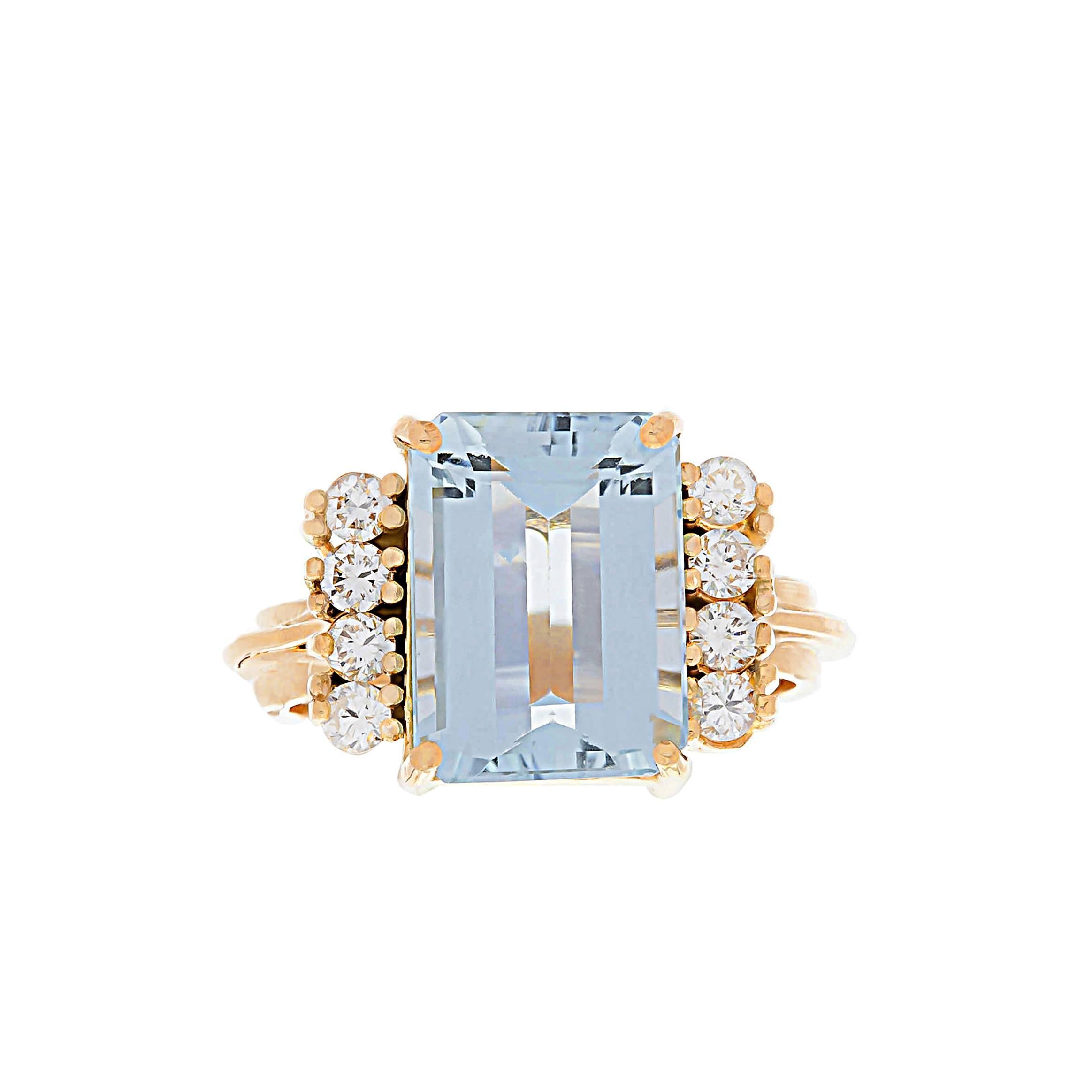 14K yellow gold rings with emerald cut aquamarine weighing 2.57 carats and eight round brilliant cut diamonds weighing combined 0.36 carat.
Can be sized.