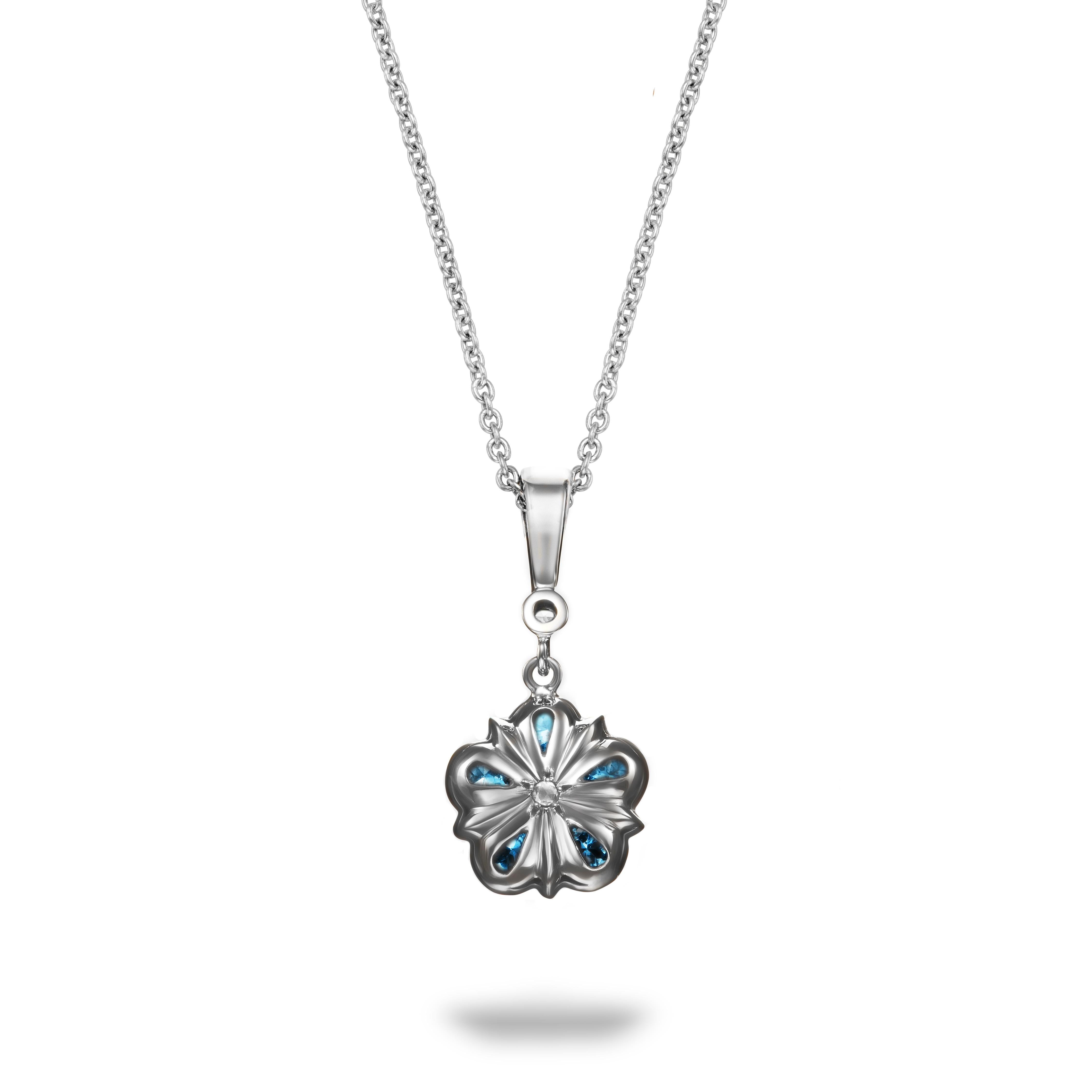 This pretty aquamarine and rose cut diamond Rose pendant features vibrant aquamarines surrounding a rose cut diamond. In true Aril Jewels style, the back of the pendant is just as gorgeous, featuring another tiny rose cut diamond - an extra detail