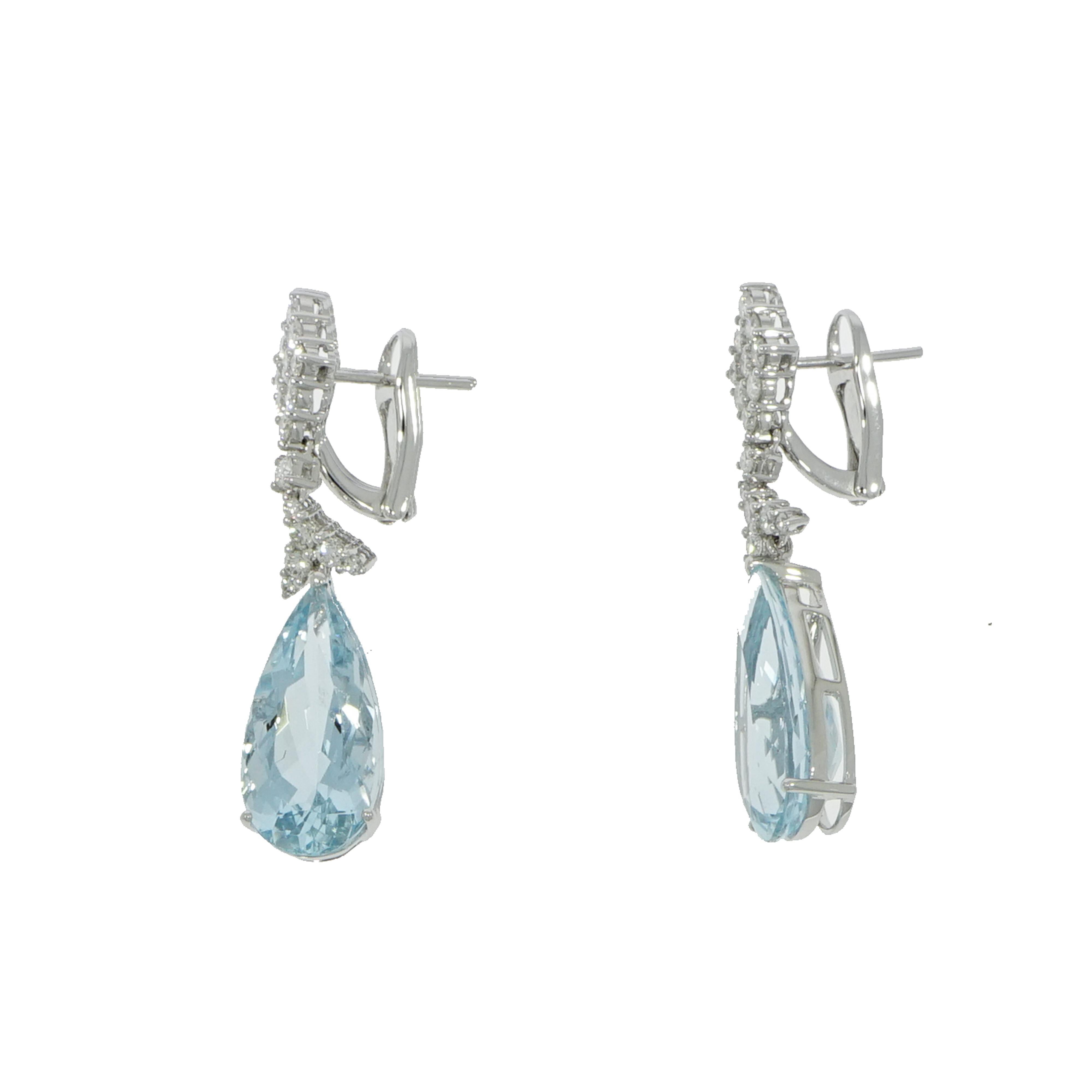 Step up any summer look with a long and lean pair of earring, just like these soft blue shade of Aquamarine, accented by diamonds to add sparkle. This style elongates the face and is extremely on-trend for the season. 
Handcrafted in Italy