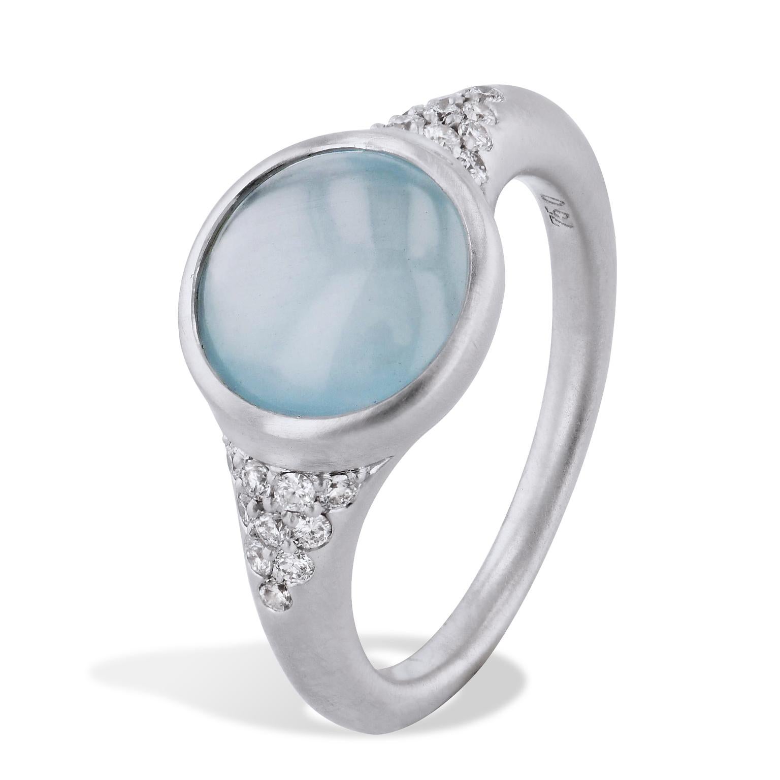 Aquamarine and Diamond White Gold Ring

Always have the color of the sea at your fingers with this 2.72 carat cabochon cut aquamarine stone, centered in an 18 karat white gold band holding pave set diamonds (size 6.5).