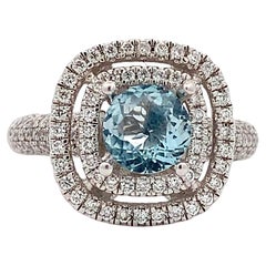 Anillo de compromiso doble halo aguamarina y diamantes oro blanco 18k