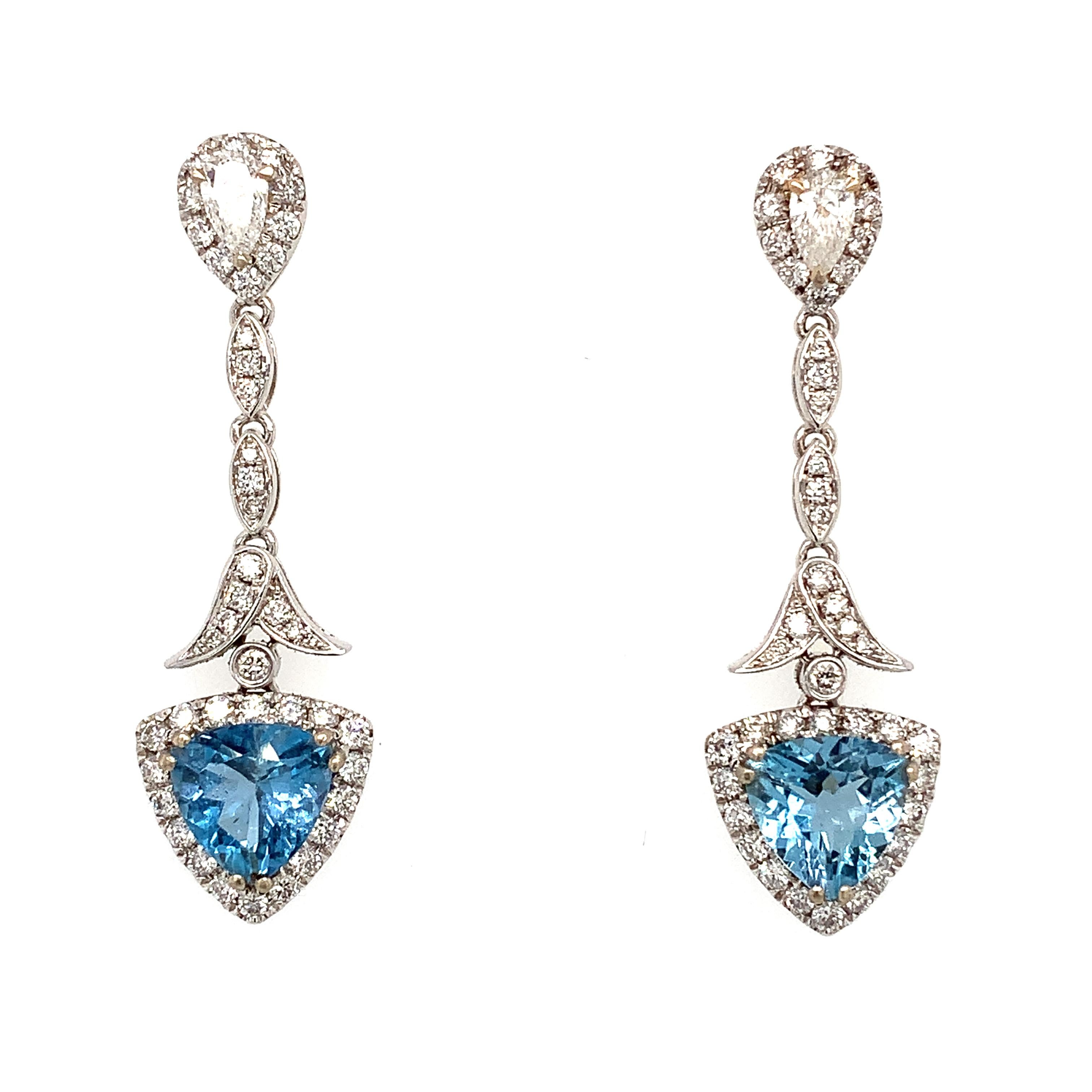 Gorgeous aquamarine and diamonds drop dangle studs earrings in 18ct white gold. 
Composed of trillion cut light blue sky aquamarine gemstone accented by pear shaped and round brilliant cut diamonds drop long earrings all mounted in 18k white