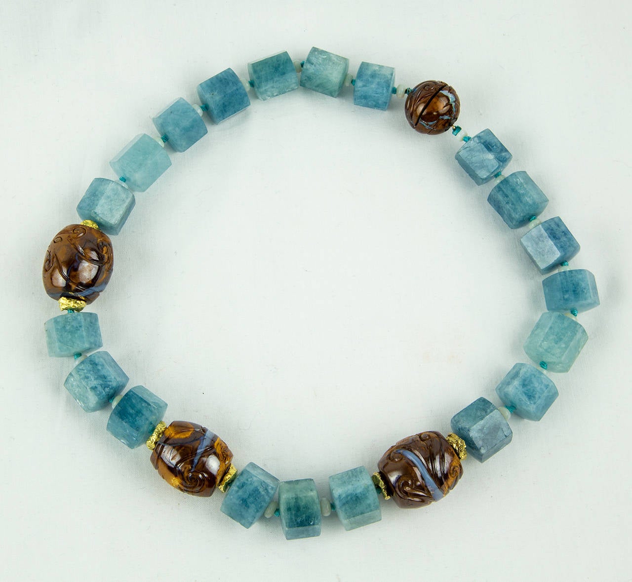 Simply Beautiful! Hand carved Hexagon Aquamarine and Natural Opal in Matrix Beads inter-spaced with Gilt Sterling Silver Rondelles featured in this Fabulous Hand crafted Necklace. Held by an enhanced Crystal clasp. Necklace measures approx. 17.5”