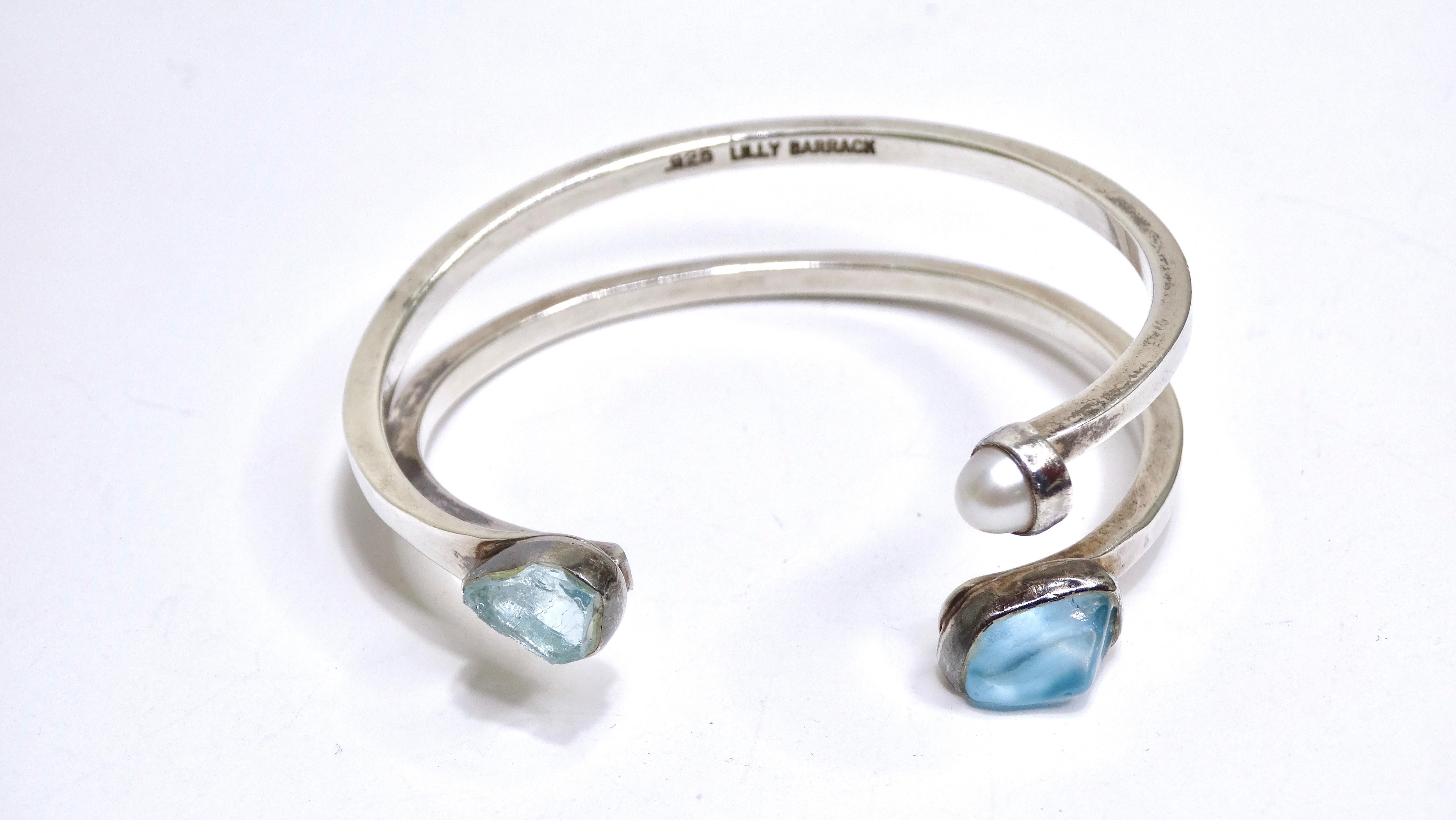 Just wait and see all the compliments you will receive on this immaculate aquamarine and pearl cuff. It has just a certain type of elegance and beauty that will draw people in. One pearl is accompanied by one natural and one polished aquamarine