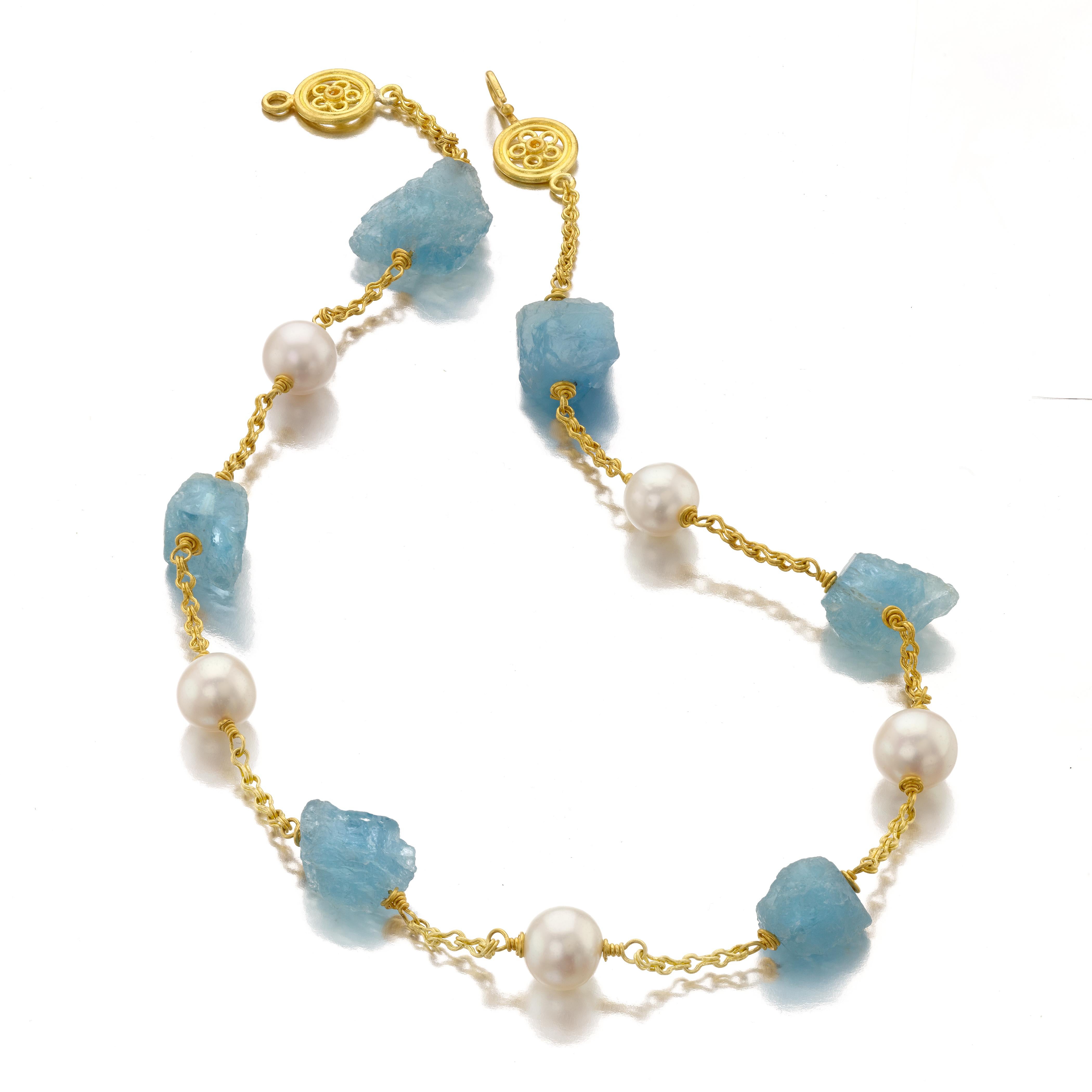 Natural Aquamarine crystals and 10 millimeter round cultured white pearls necklace in high 22 Karat gold with beautiful clasp. Elegant with soft tones, the necklace is an easy wear, going from day to night seamlessly. 
18.5 inches long and is