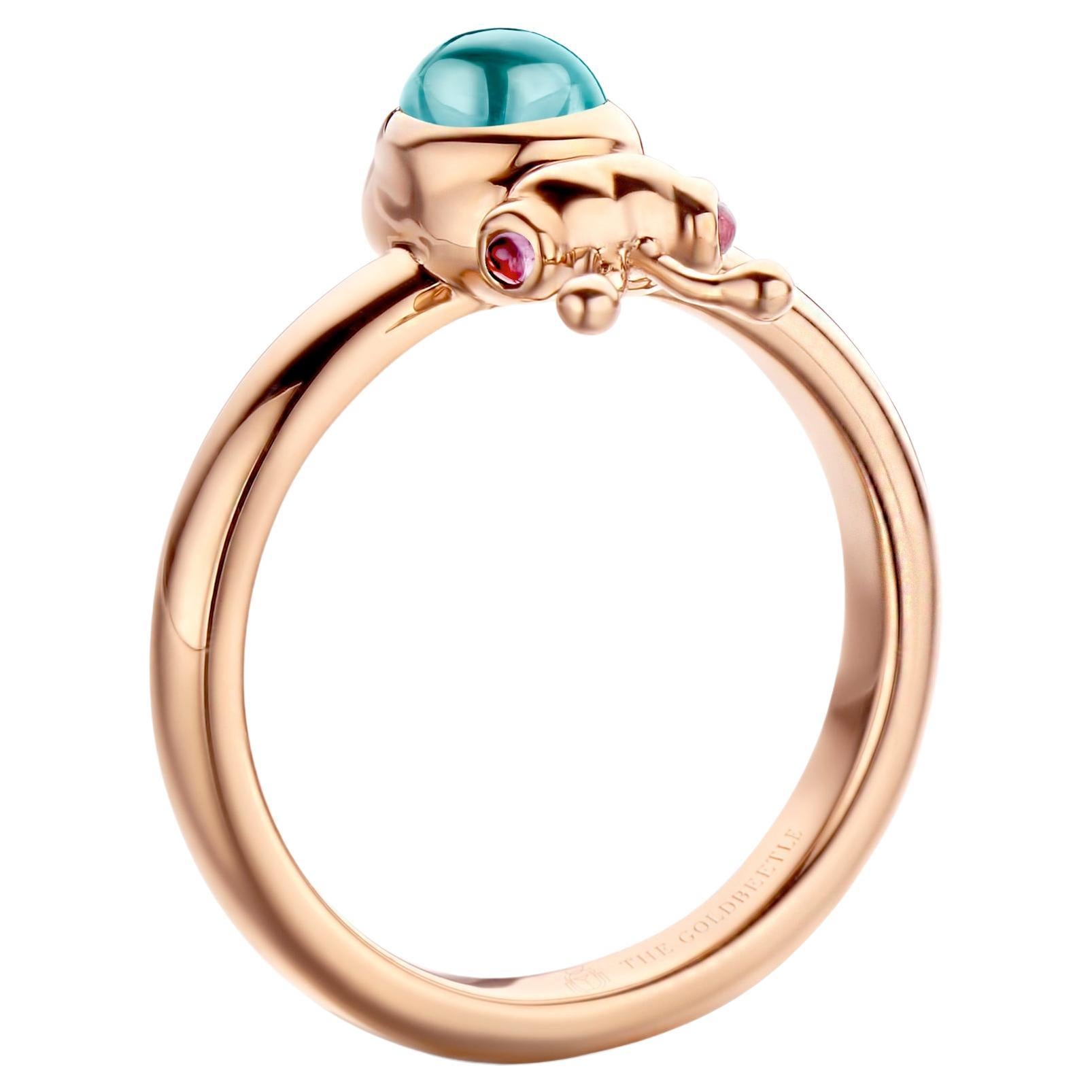 18 karat rose gold Lilou ring set with one natural aquamarine pear-shaped cabochon and two natural pink tourmalines in round cabochon cut
Celine Roelens, a goldsmith and gemologist, specializes in unique, fine jewelry, handmade in Belgium and