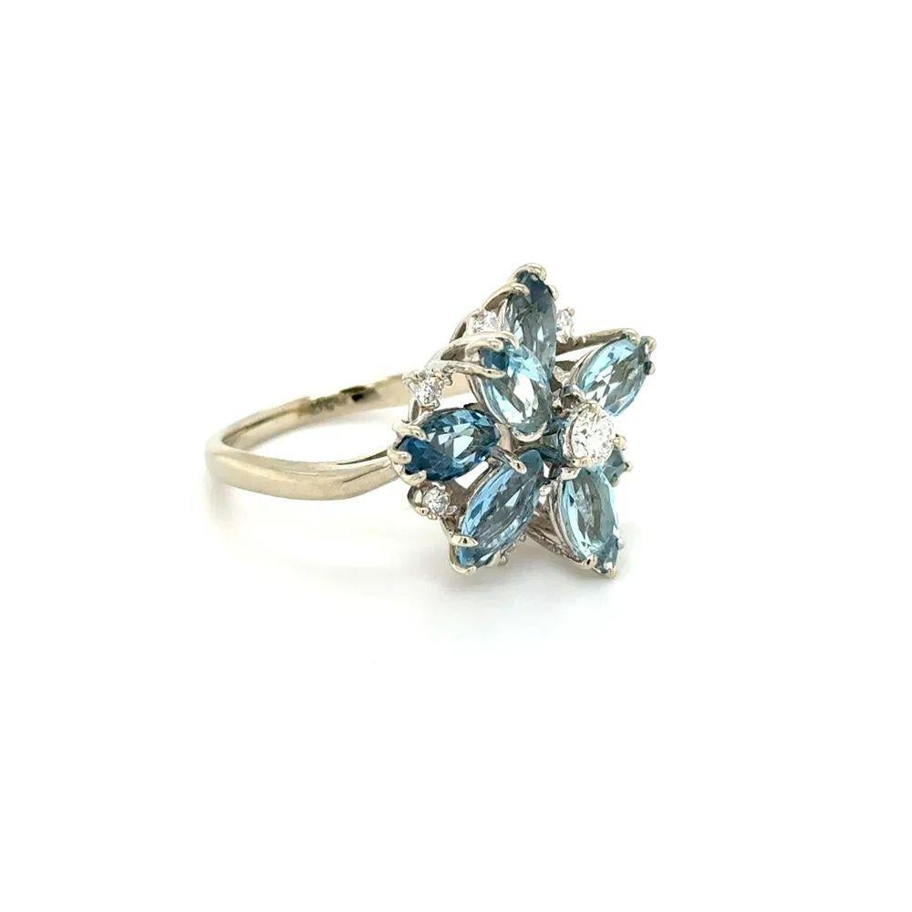 Semplicemente bello! Anello a grappolo in oro con acquamarina e diamante Vintage. Incastonato a mano con un'acquamarina del peso di circa 1,50tcw e con diamanti rotondi taglio Brilliante del peso di circa 0,32tcw. L'anello è realizzato a mano in oro