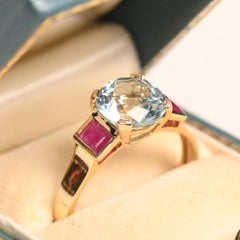 18k Gold Aquamarine and Ruby Ring. 1.60ct Round Aquamarine Baguette Ruby Side