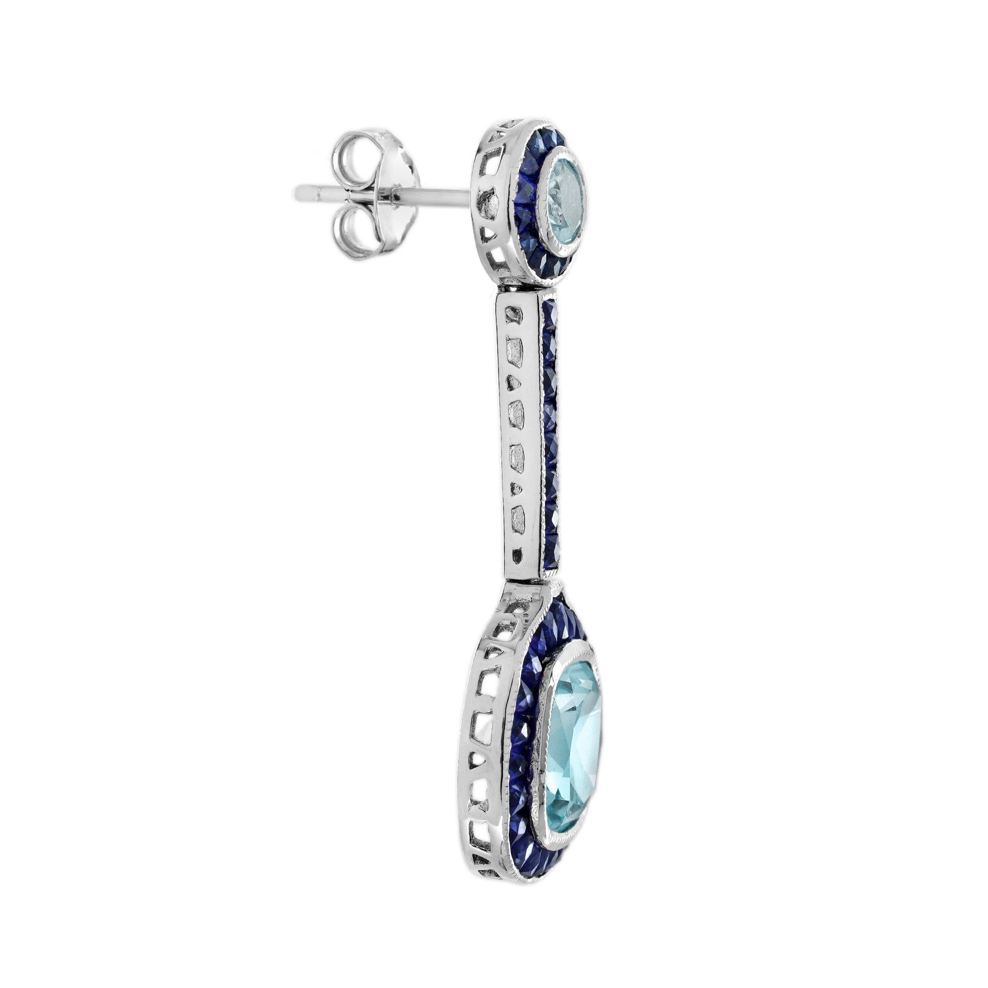 Feature a small round aquamarine stone surrounded by sapphires at the lobe part, elegantly connected to a larger cushion shape aquamarine surrounded by the French cut blue sapphires as well. The two aquamarines are linked with a delicate line of