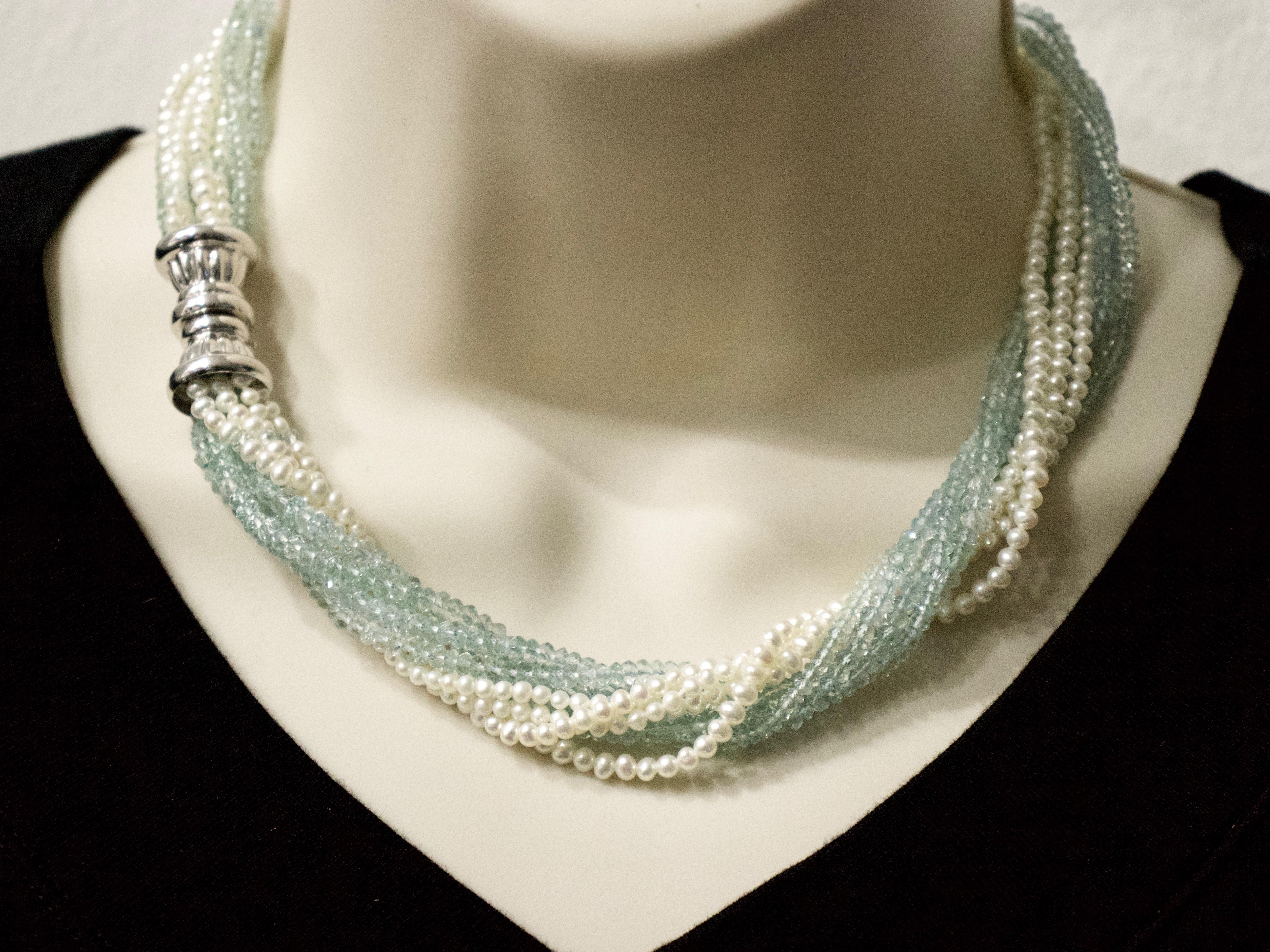 Stunning faceted ocean blue of the finest quality 3.33mm aquamarine beads intertwined with white seed pearls to make a 10-strand torsade necklace joined together with a 18k white gold Italian clasp.
This handmade and exclusive creation will shine at