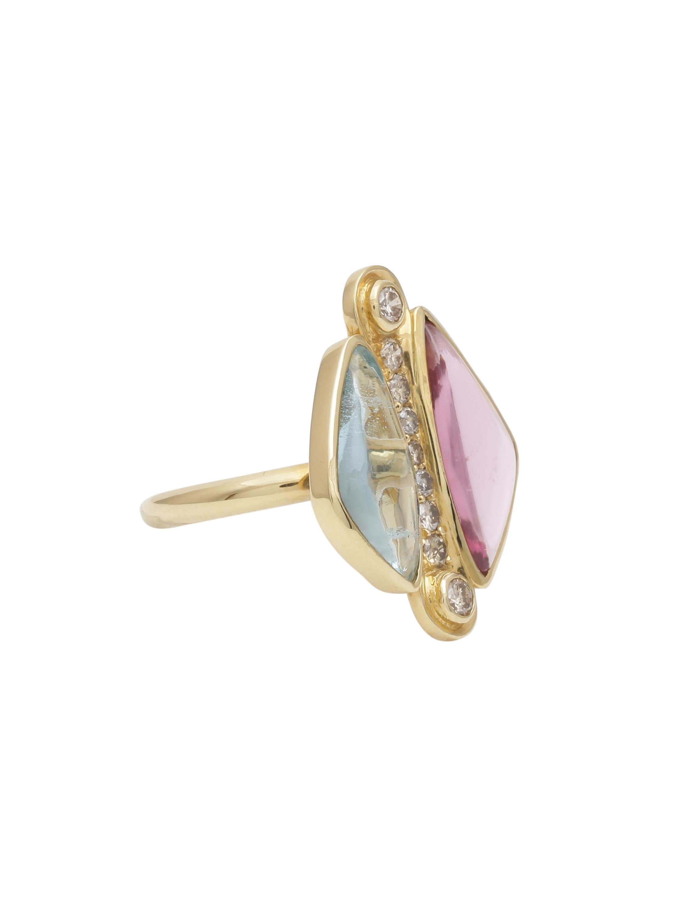 A ring with customised size Aquamarine and natural spinel put together with a line of graduating diamonds in the centre. The Stones were cut for each other as the colours are both pastel and soothing.
The ring is Handcrafted in 18K yellow Gold.
Its