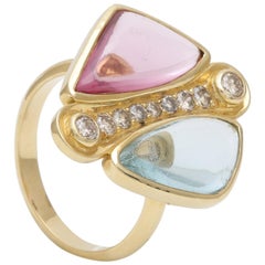 Anello con acquamarina e spinello cabochon e diamanti, realizzato a mano in oro giallo 18 ct.