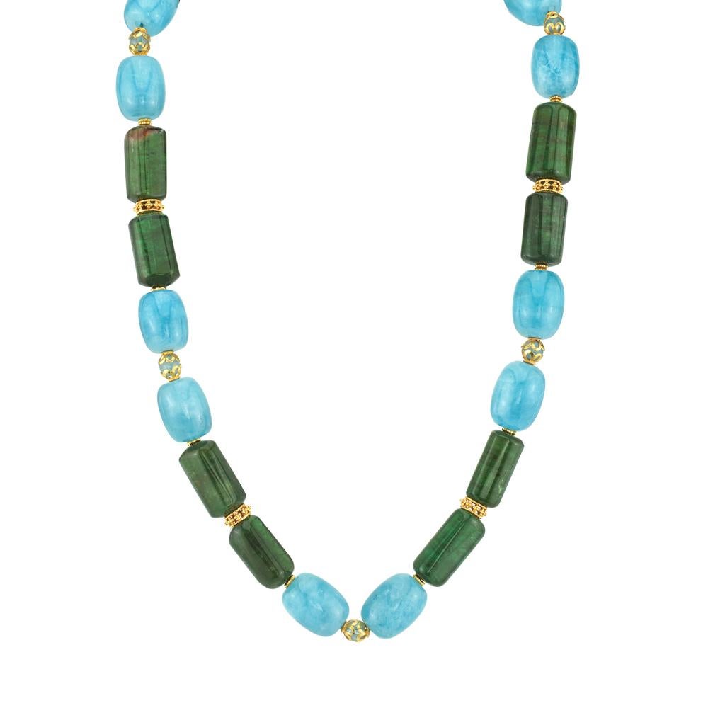 This colorful necklace features vibrant blue aquamarines and rich green tourmaline beads, hand strung with 18k and 22k yellow gold spacers. Each bead is extremely fine quality, with superior color and luster. A contemporary look with gemstones that