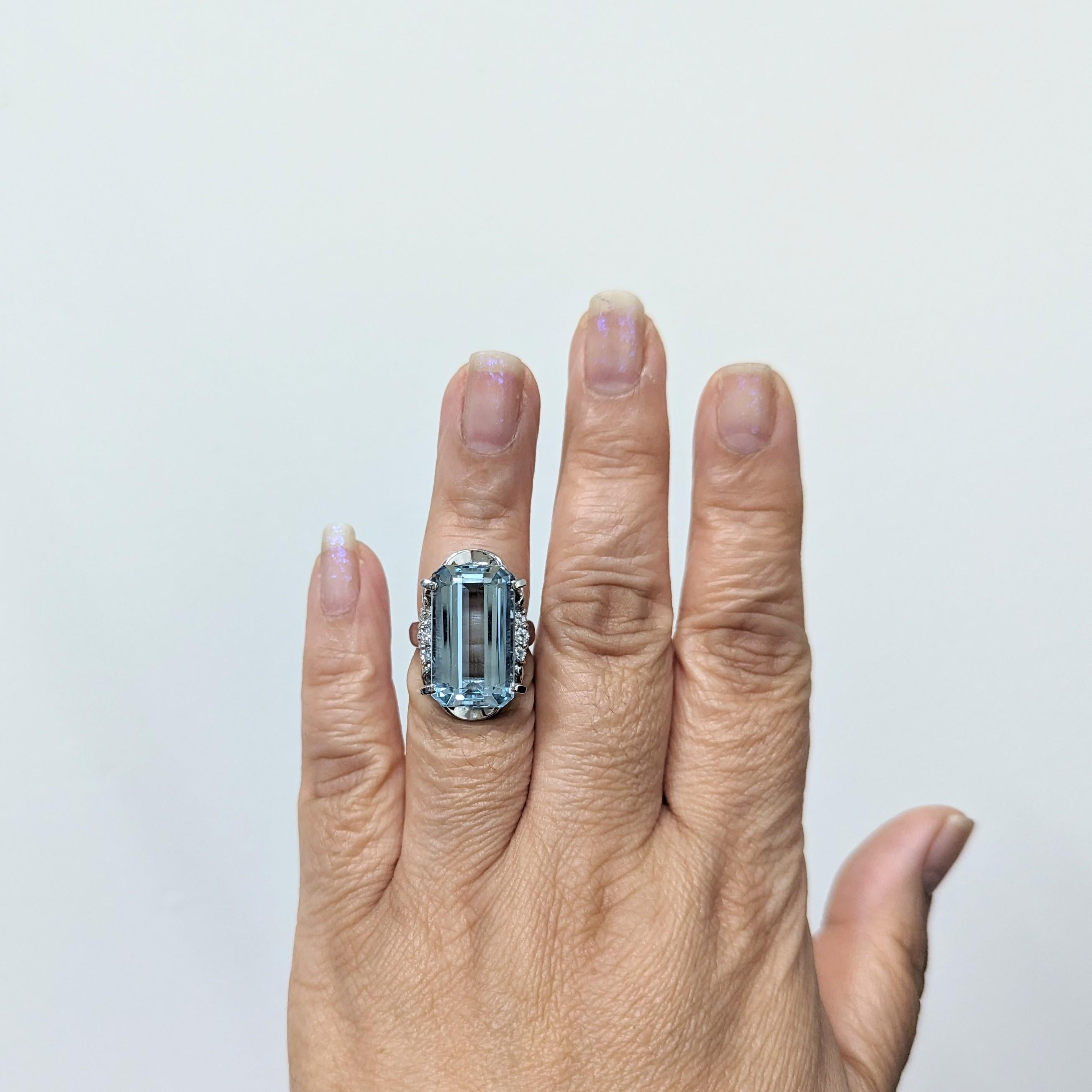 Gorgeous 14.83 ct. aquamarine emerald cut with 0.28 ct. white diamond rounds.  Handmade in platinum.  Ring size 6.