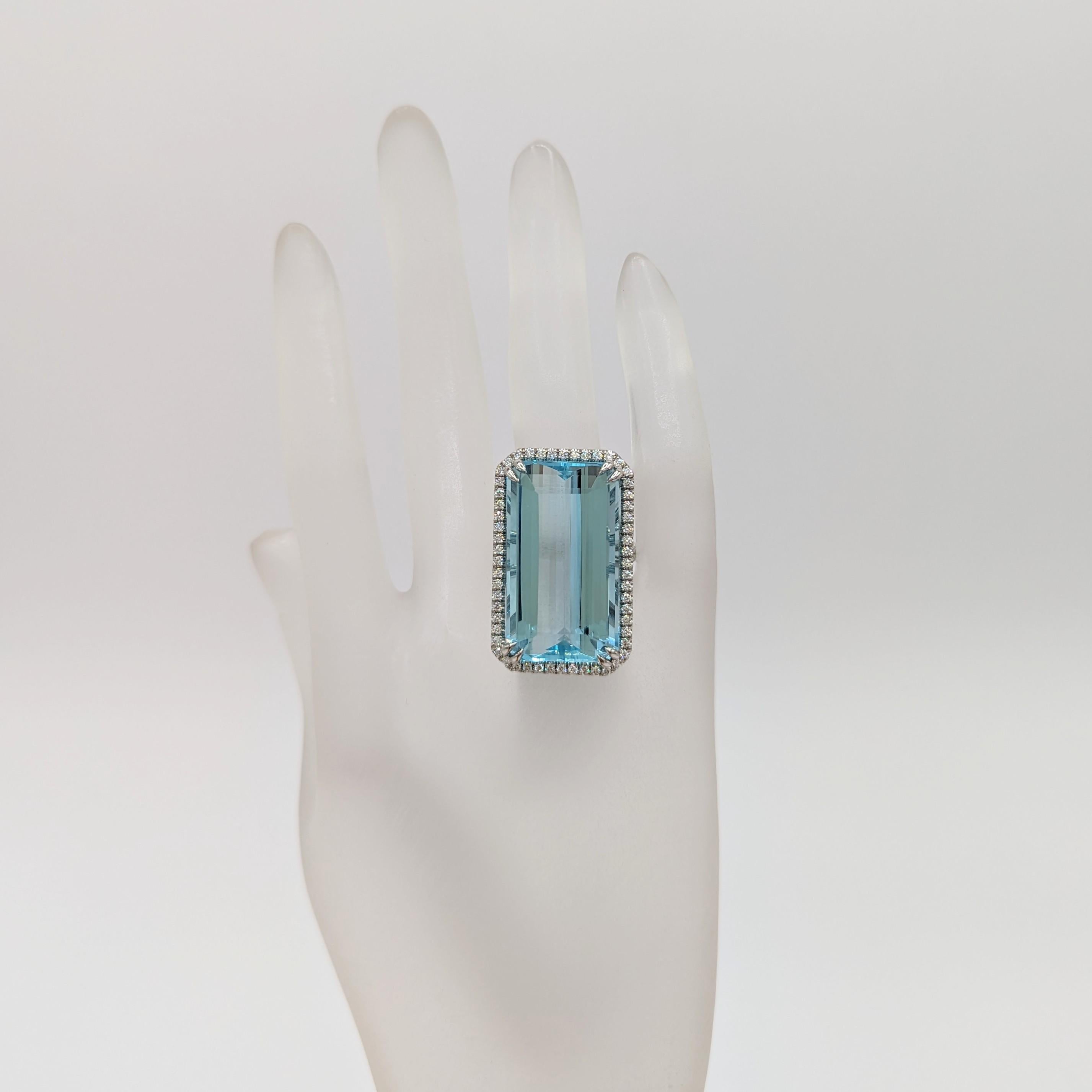 Gorgeous 34.88 ct. aquamarine emerald cut with 1.02 ct. good quality white diamond rounds.  Handmade in platinum.  Ring size 6.5.