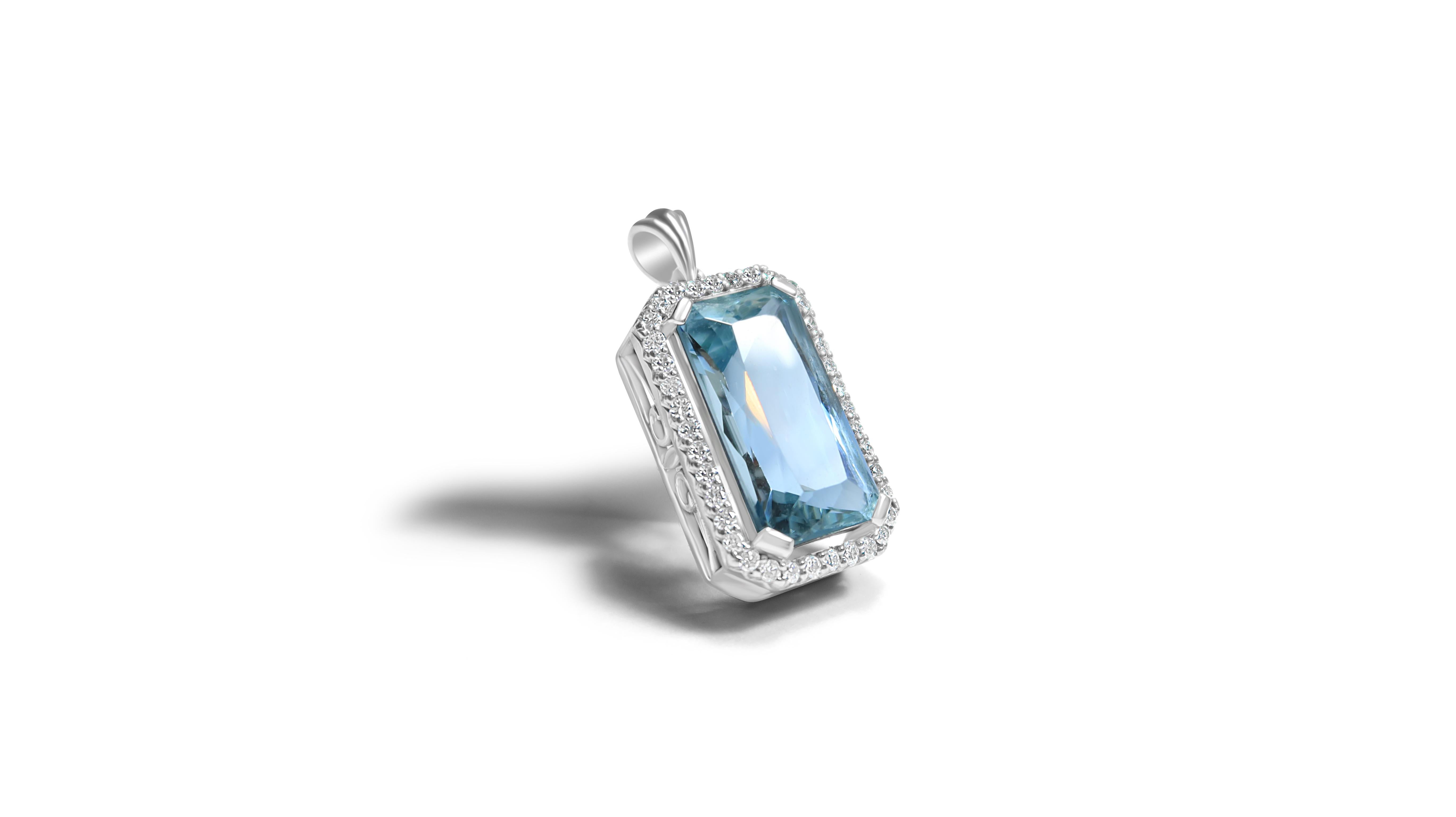 The treasure of mermaids, beautiful vivid pastel blue aquamarine gemstone from Madagascar set in a dazzling natural diamond halo.   This scissor / emerald cut aquamarine pendant is a perfect addition to your jewellery collection and would adorn any
