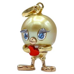Collana con ciondolo o charm a forma di cuore di uccello in oro 18Kt con acquamarina australiana e perla d'oro