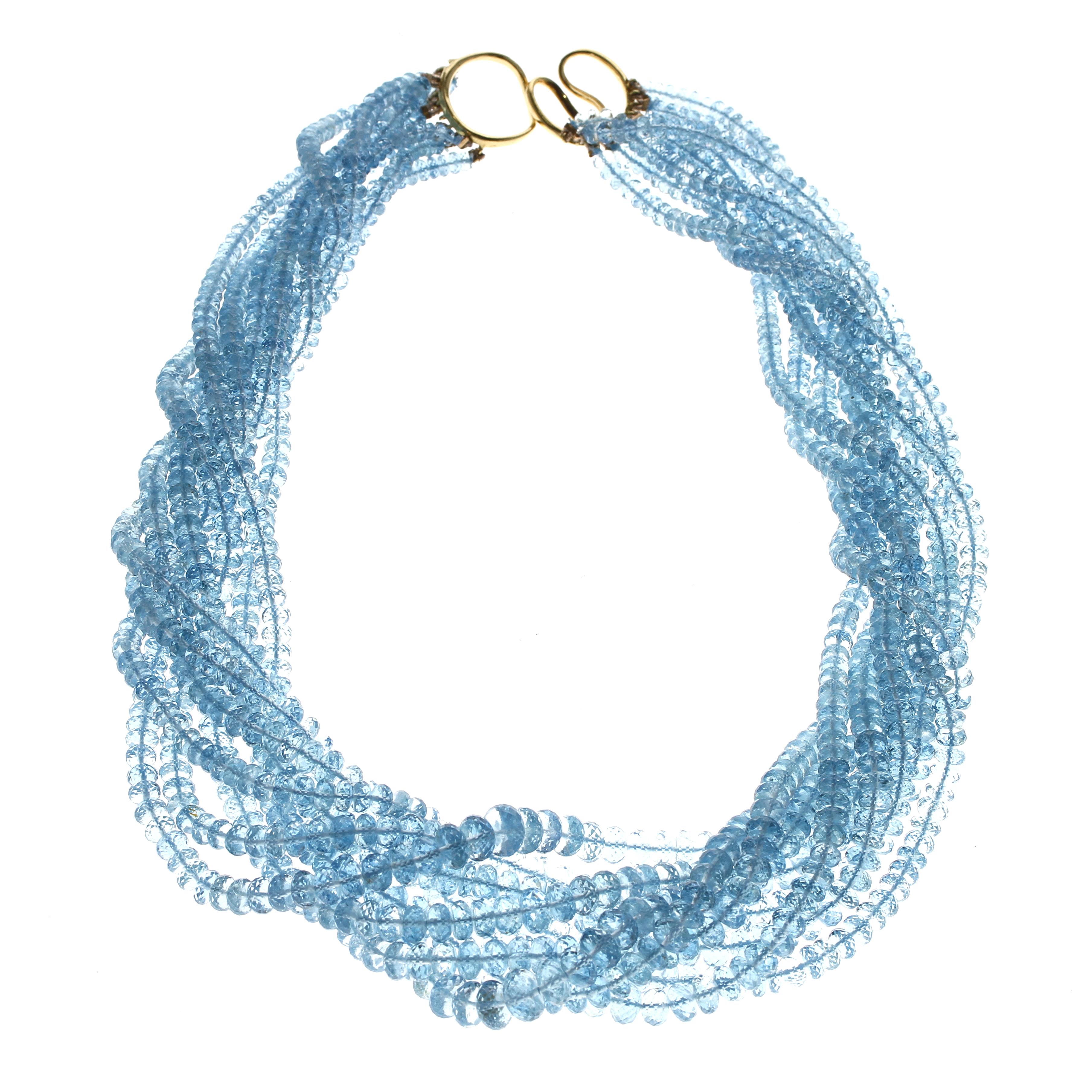 An extremely fine aquamarine bead necklace set with an 18kt yellow gold clasp; the total weight of the necklace is 845 carats; the length is 18.5 inches.