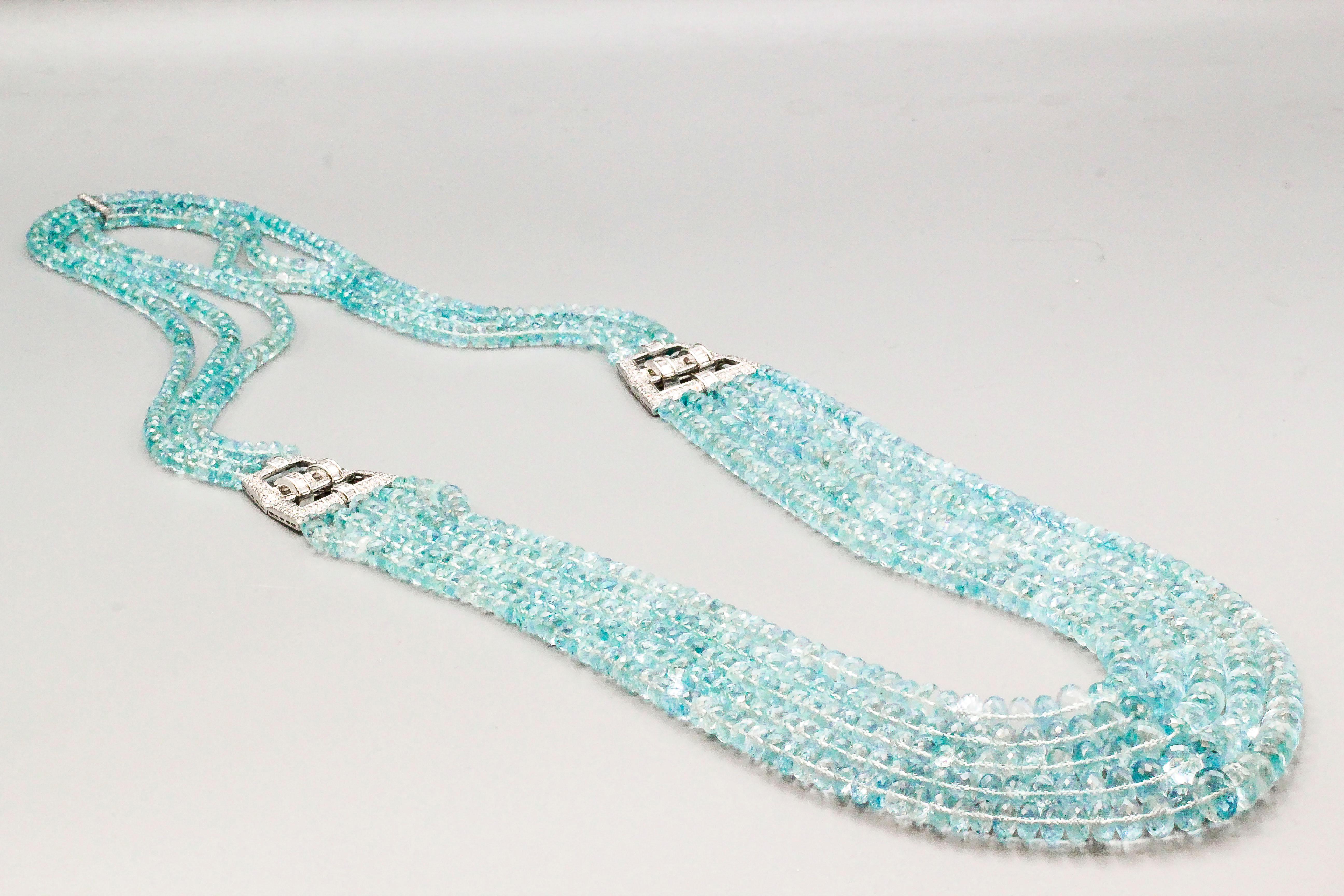 Impressive multi-strand faceted aquamarine bead necklace with 18k white gold and diamond accents, circa 1970s. It features approx. 1100 cts of aquamarines and approx. 3cts of high grade round and baguette cut diamonds. This necklace is further