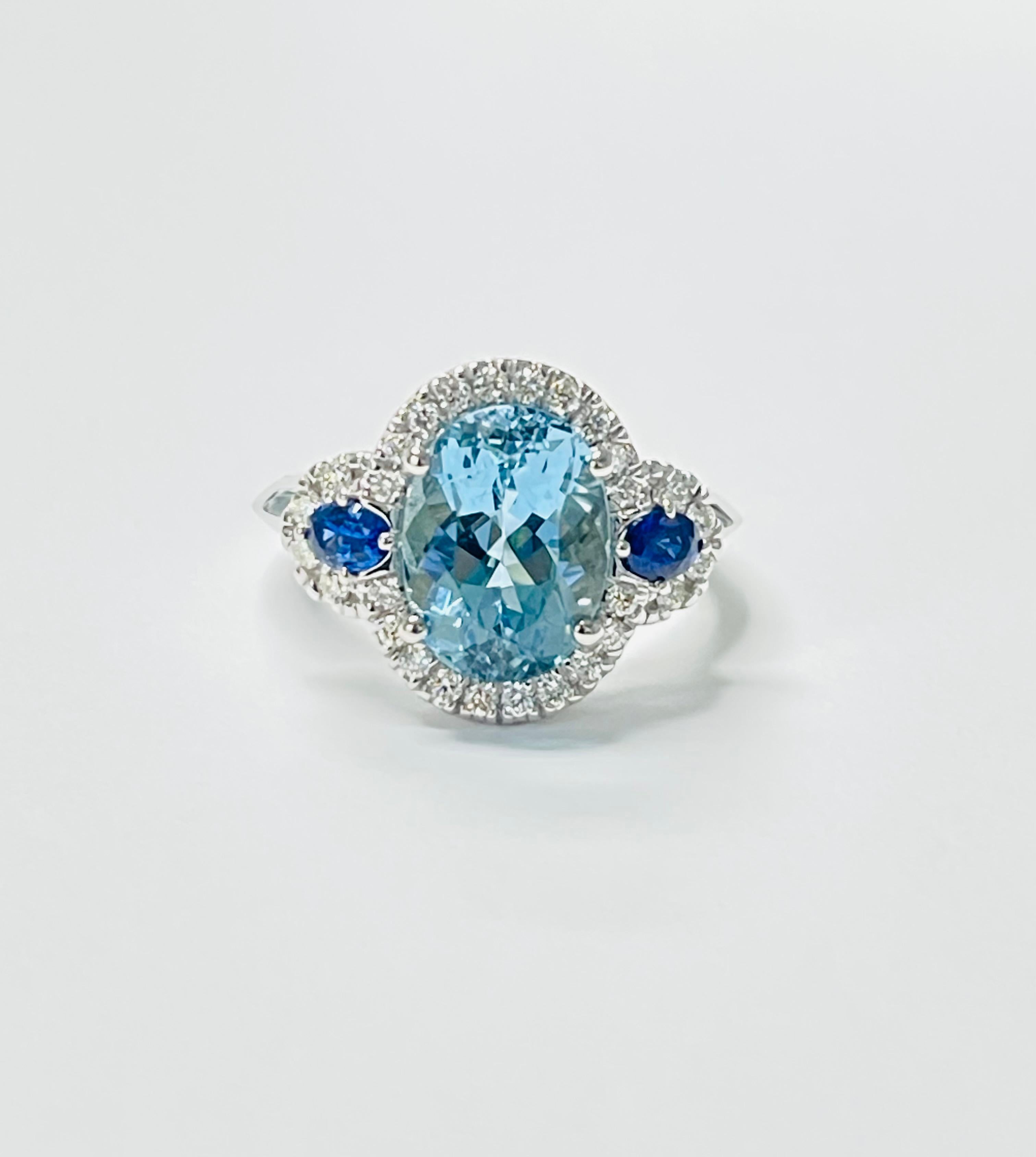 Aquamarine, blue sapphire and diamond engagement ring beautifully handcrafted in 14 karat gold. 

The details are as follows: 

Aquamarine weight : 4 carat 
Blue sapphire : 0.25 carat 
Diamond weight : 0.38 carat ( G color and VS clarity ) 
Gold :