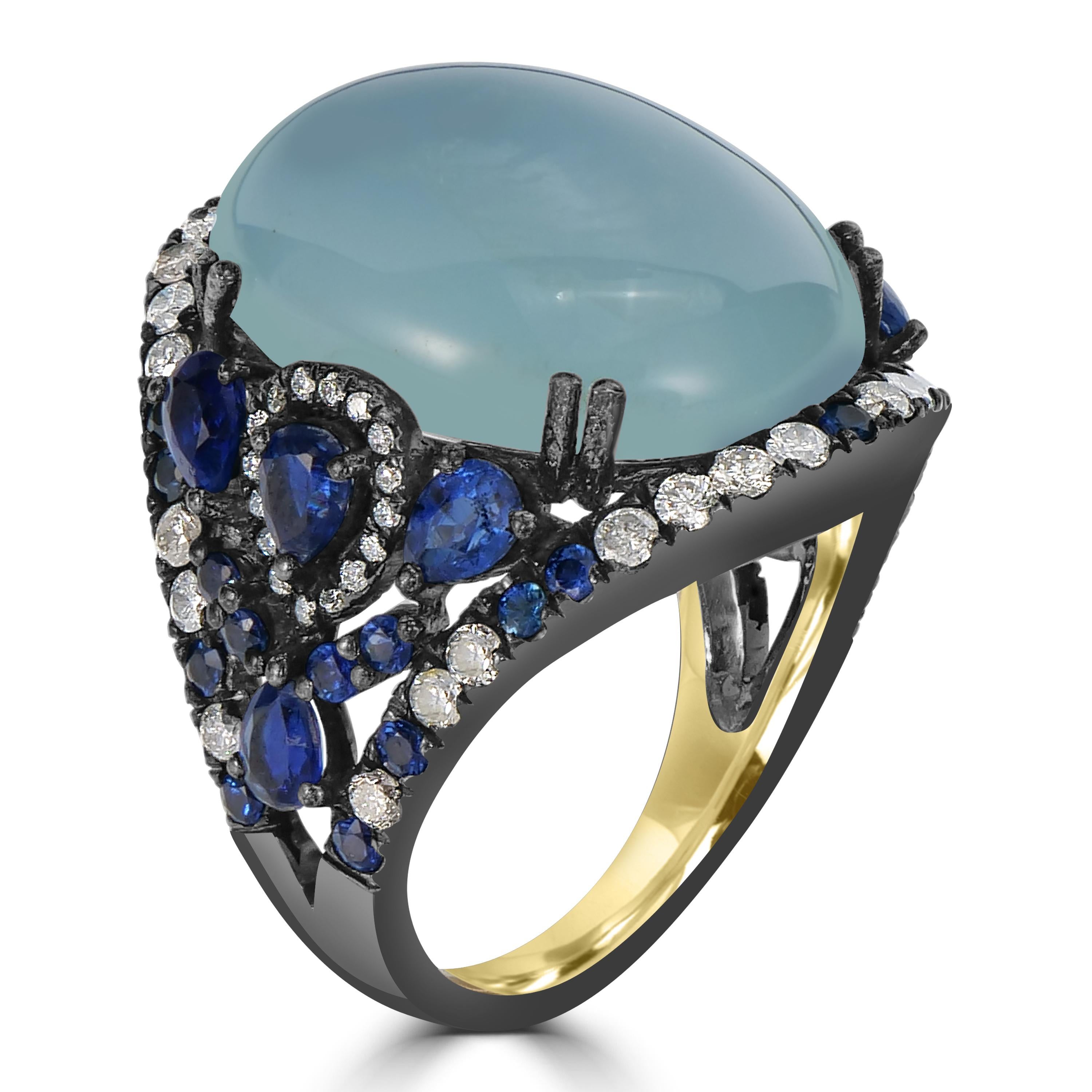 Introducing our stunning Victorian Split Shank Dome Ring, an exquisite piece that harmoniously combines the serene beauty of aquamarine, the rich allure of blue sapphires, the unique charm of kyanite, and the timeless sparkle of diamonds. Crafted in