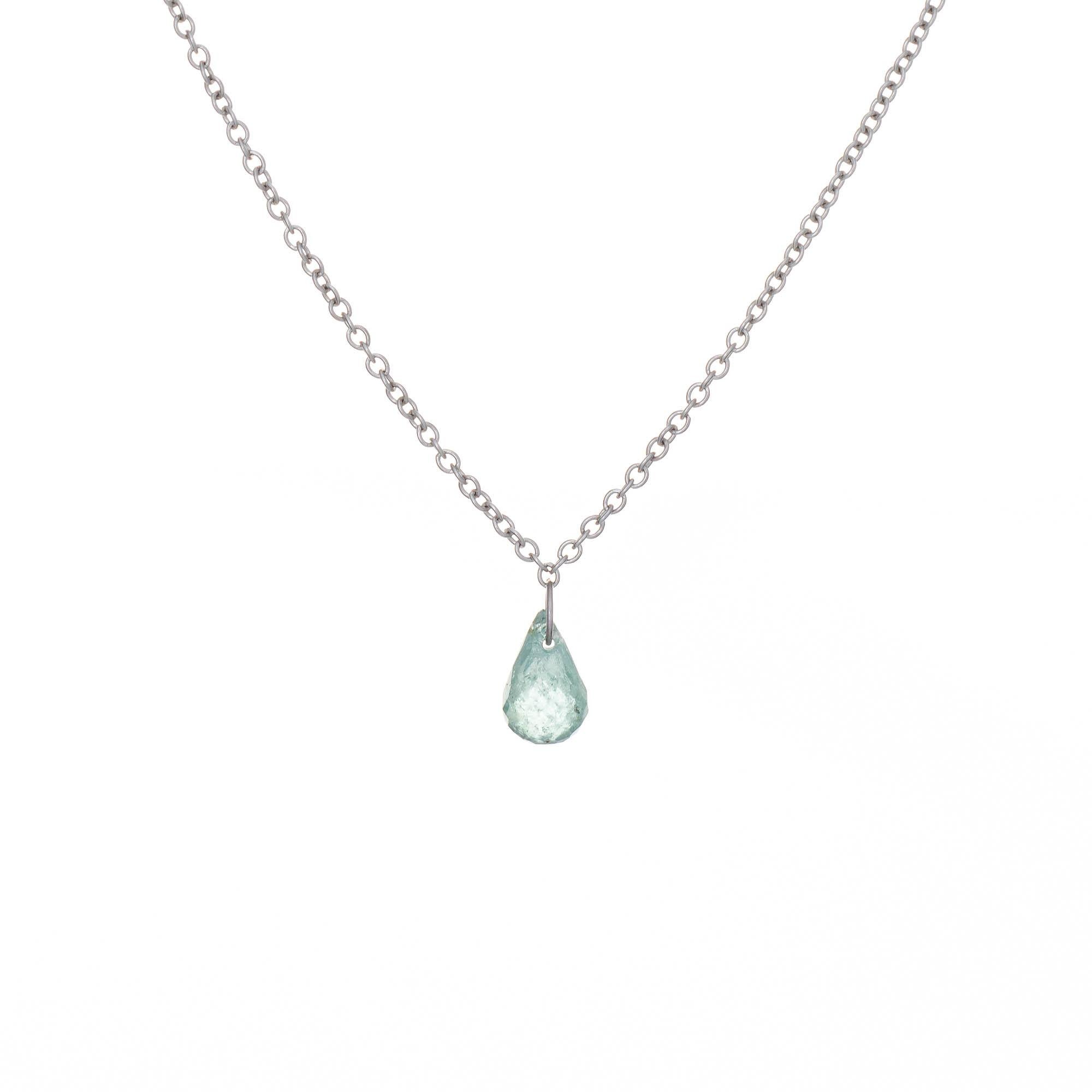 Stylish aquamarine necklace crafted in 14 karat white gold.  

Aquamarine briolette measures 6.3mm x 4mm (in excellent condition and free of cracks or chips). 

The small aquamarine is suspended from a small wire hoop, allowing the aquamarine to