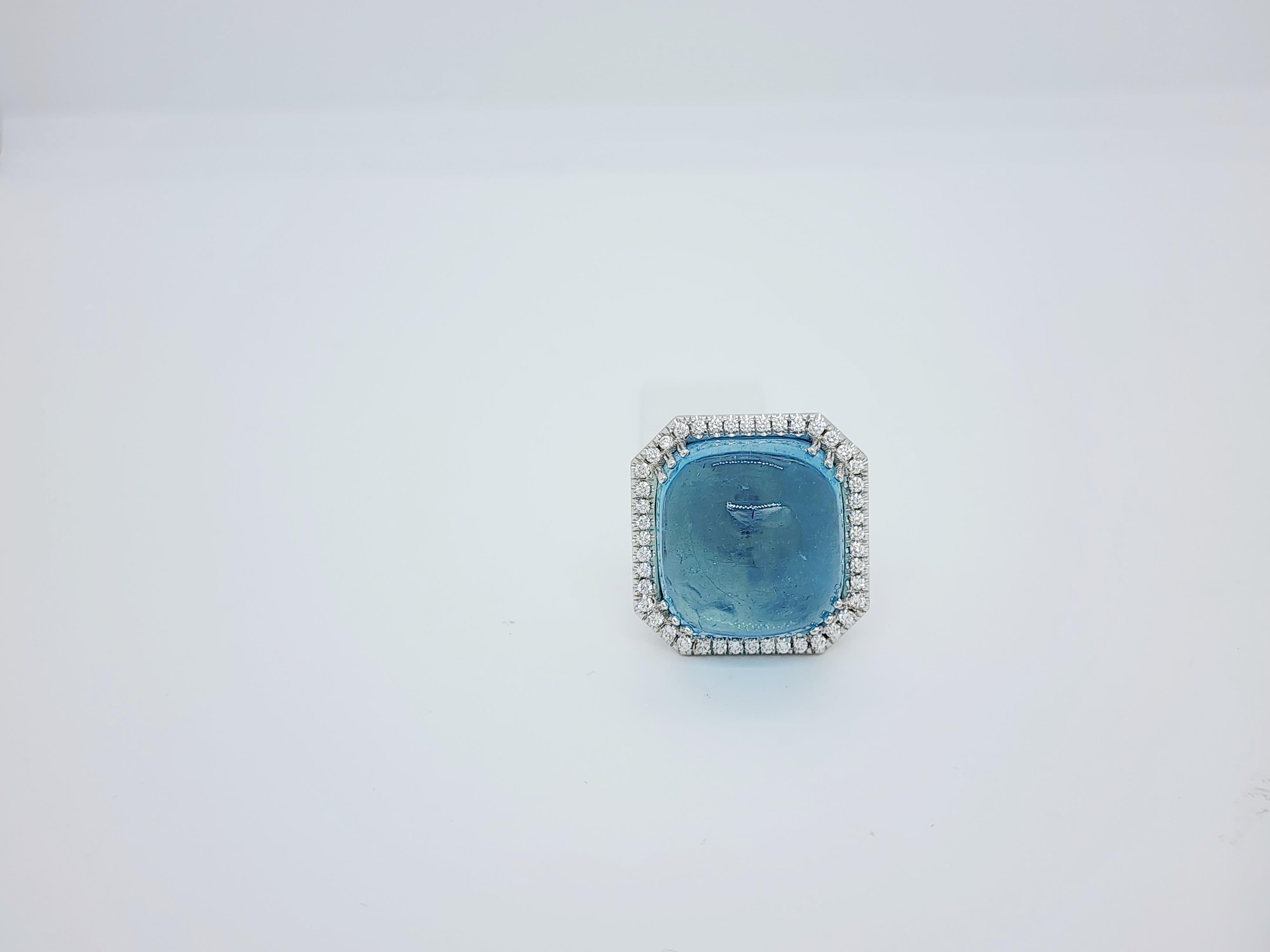 Gorgeous 42.40 ct. aquamarine cabochon with 1.00 ct. good quality white diamond rounds.  Handmade in 18k white gold.  Ring size 4.75.