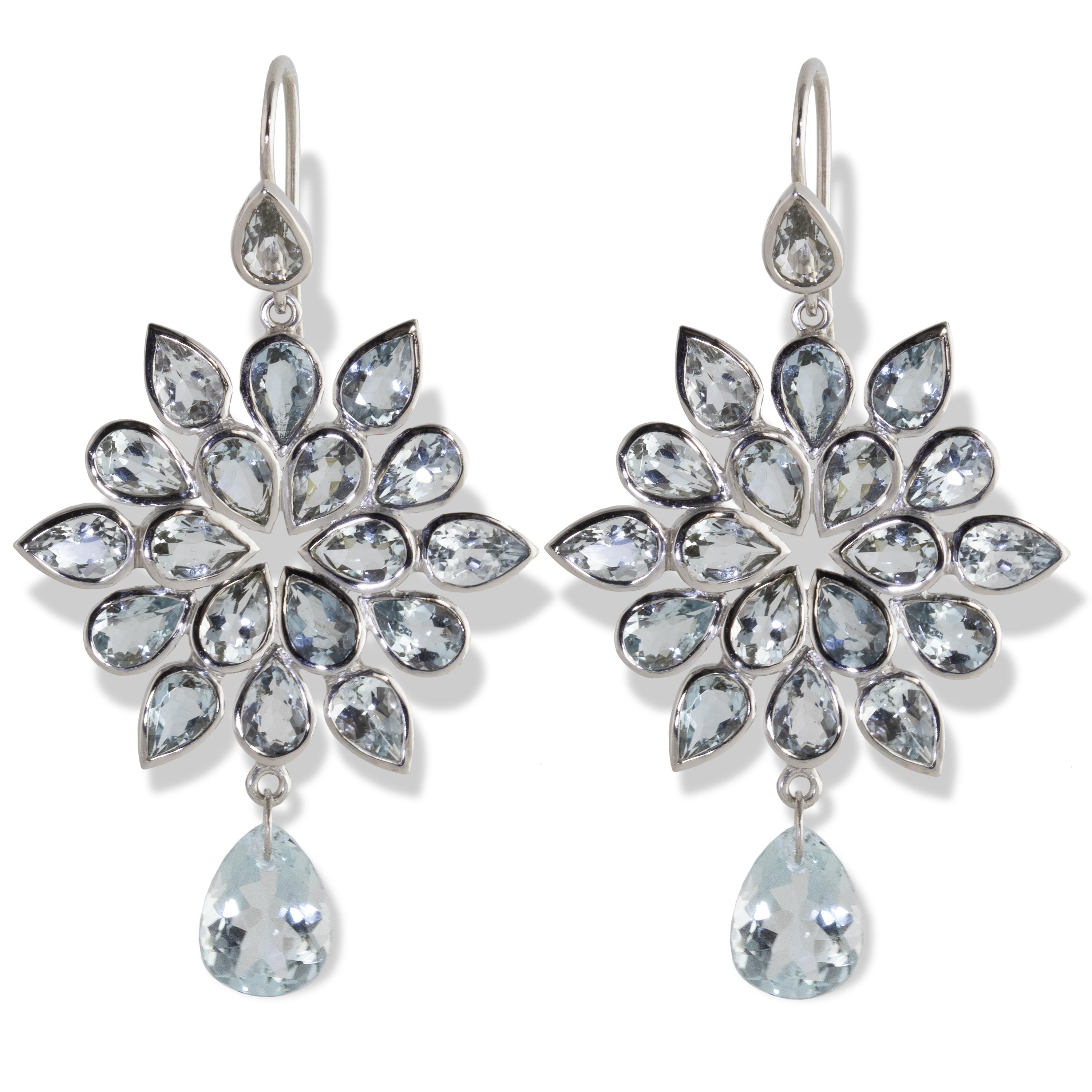 Spectacular Aquamarine ‘Ocean Flower’ Chandelier Earrings. 14.25 carats of glamorous and dramatic Brazilian Aquamarine pear-shaped gems form a layered flower shape with an aquamarine drop at the bottom. Set in 18k white gold.  

Ancient sailors