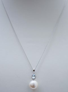 Aquamarine Colour Topaz, Diamonds, Pearl, 18 Karat White Gold Pendant Necklace.
