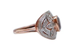Anillo con topacio color aguamarina, diamantes, oro rosa y plata