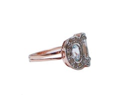 Topacio color aguamarina, diamantes, anillo de oro rosa y plata.