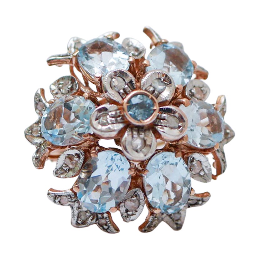 Aquamarine Colour Topaz, Diamonds, Rose Gold and Silver Ring.
