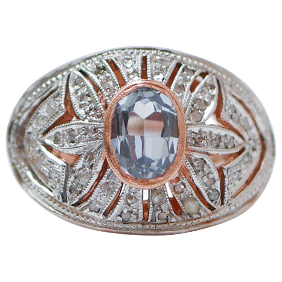 Bague en topaze couleur aigue-marine, diamants, or rose et argent