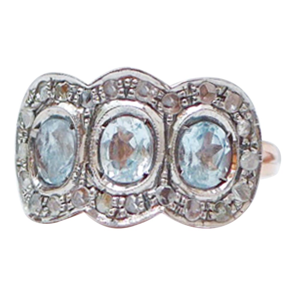Aquamarine Colour Topaz, Diamonds, Rose Gold and Silver Ring.