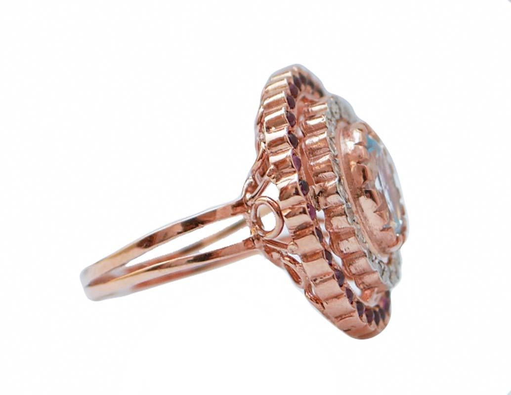 Amazing ring in 9 kt rose gold and silver structure mounted with a central topaz surrounded by diamonds and garnets
This ring was totally handmade by Italian master goldsmiths and it is in perfect conditions.
Diamonds 0.19 ct
Topaz and Garnets  3.50