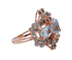 Aquamarine Colour Topaz, Sapphires, Diamonds, Rose Gold and Silver Ring.
