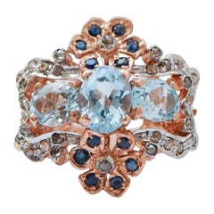 Aquamarine Colour Topaz, Sapphires, Diamonds, Rose Gold and Silver Ring.