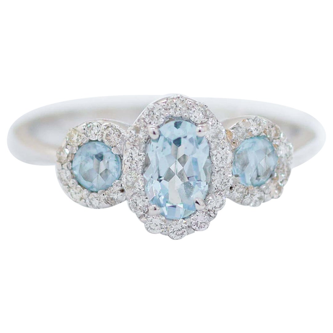 Anello con Topazi color acquamarina, diamanti, oro bianco 18 carati.