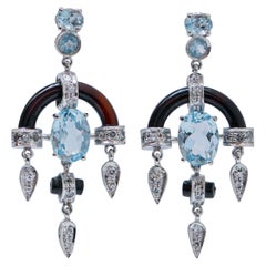 Aquamarine Colour Topazs, Diamonds, Onyx, Platinum Dangle Earrings.