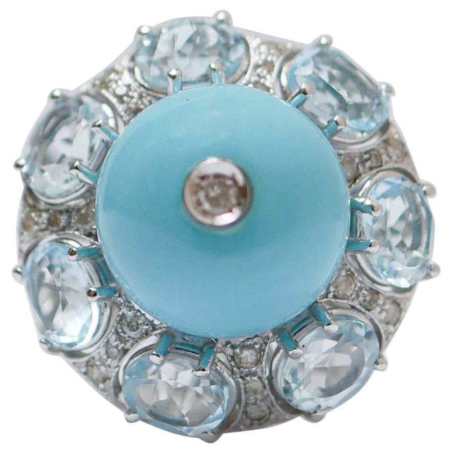 Topazi color acquamarina, magnesite, diamanti, anello in oro bianco 14 carati.