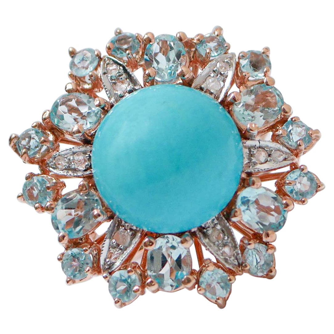 Topazi color acquamarina, magnesite, diamanti, anello in oro rosa e argento.