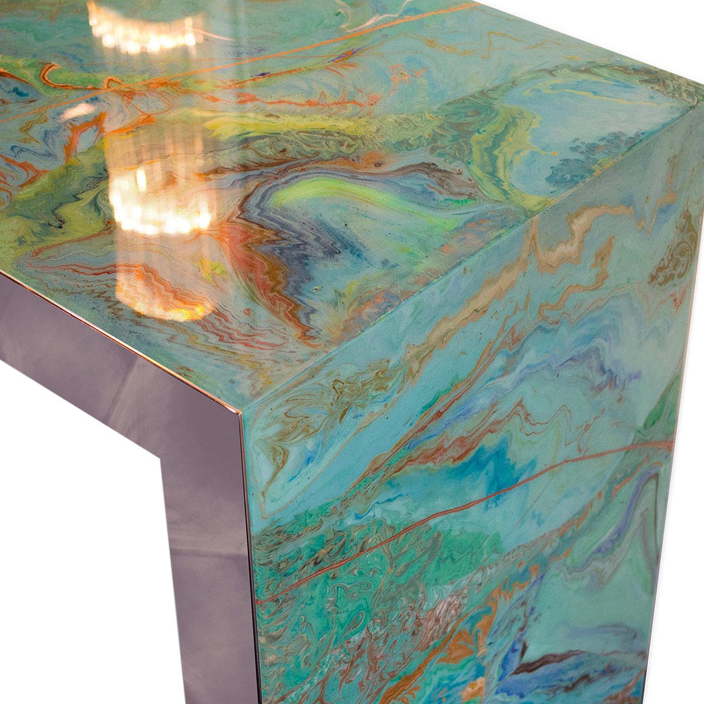 Minimal yet sophisticated, the geometric lines and luxurious texture of this console give it a glamorous appeal that will suit any dining room, living room, or foyer decor. The long, open frame is highlighted by the imposing aquamarine scagliola in