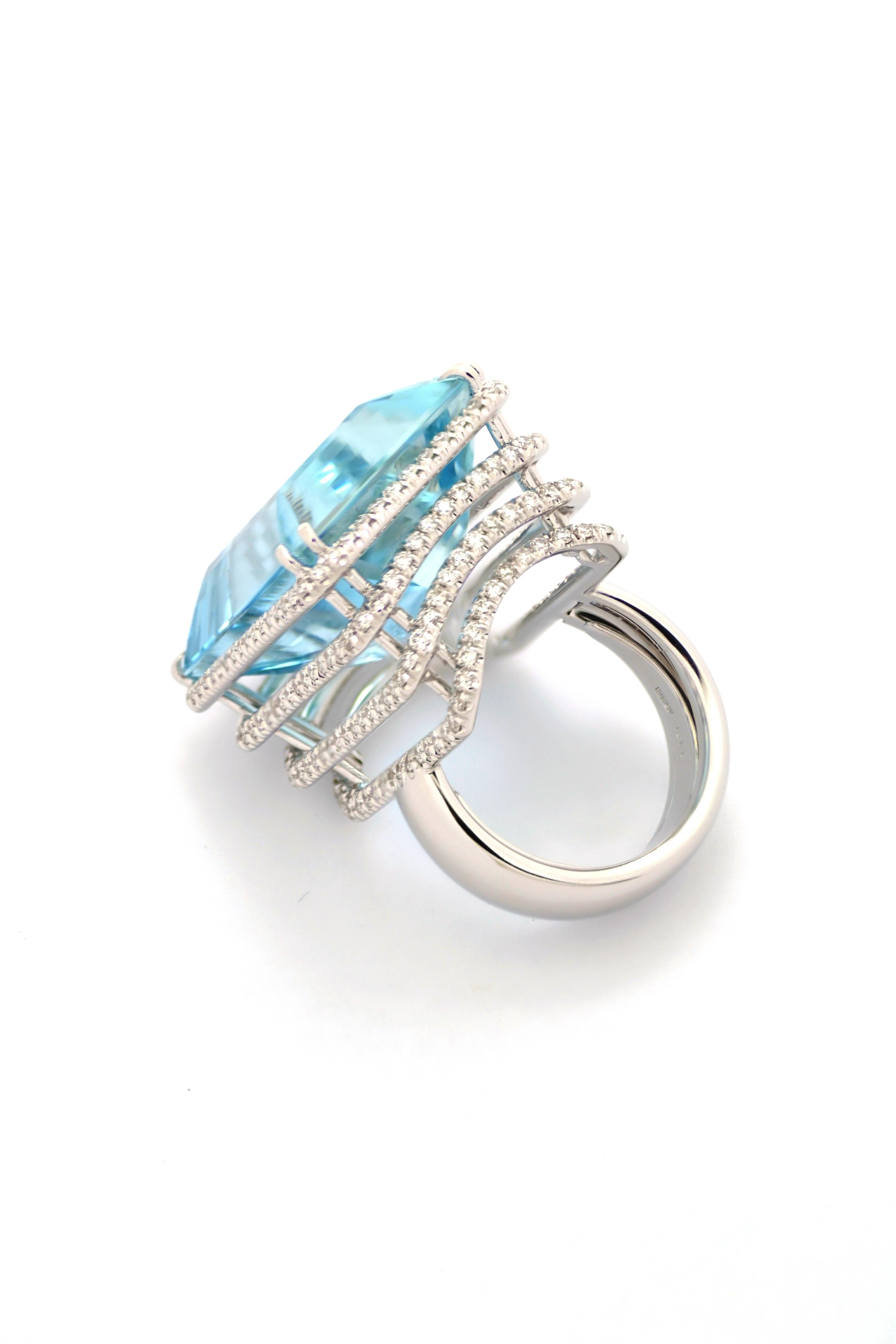 Impressive cocktail ring, designed and handcrafted in Margherita Burgener family workshop, Italy.
Centering a clean, natural, beautiful Brazilian 36.75 carat aquamarine.

18 KT white gold  grams 15.84
n. 224 diamonds total carat 1.76  quality of the